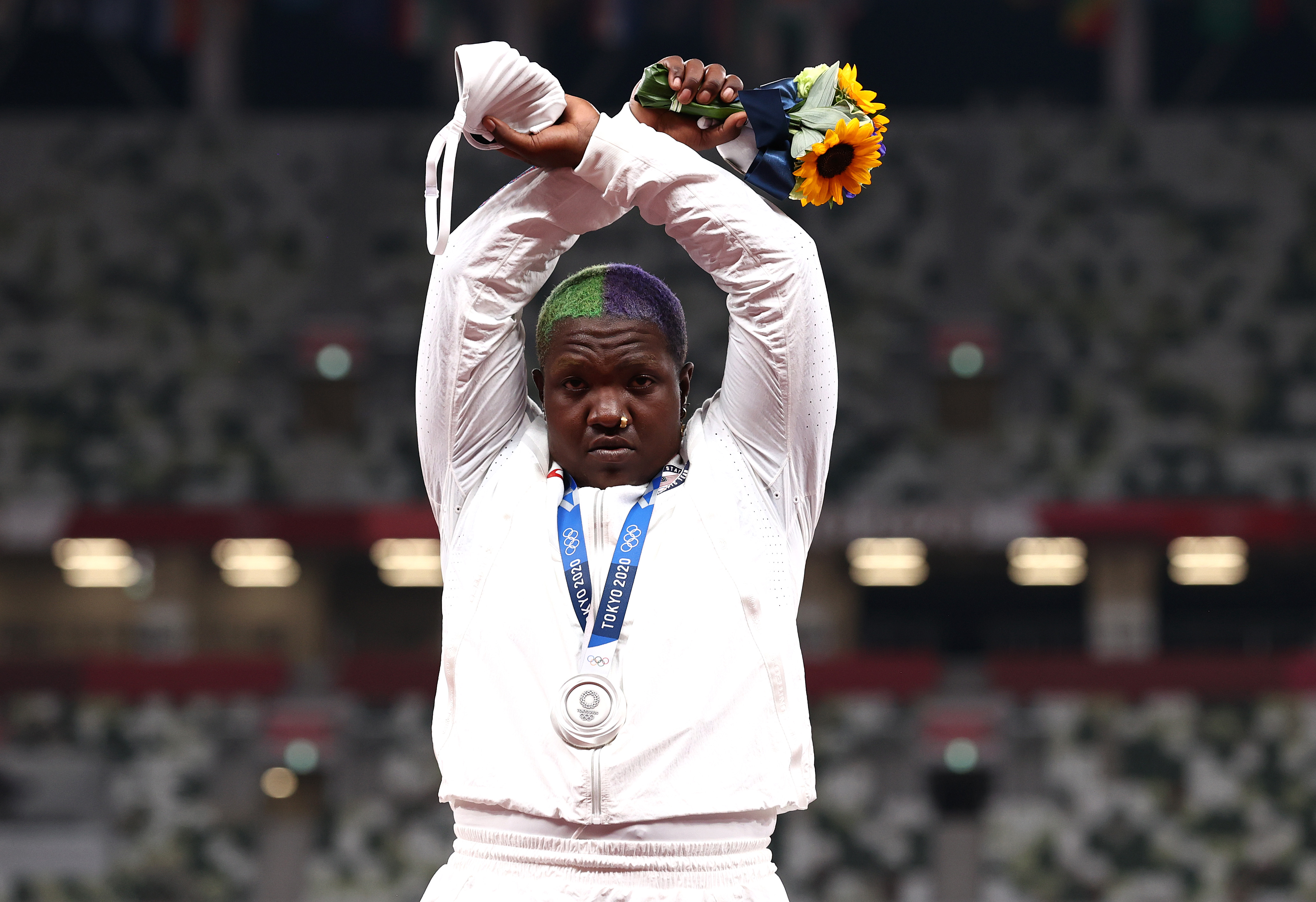 The United States' Raven Saunders makes an 'X' gesture during the medal ceremony for the women's shot put during the Tokyo Olympic Games in August 2021.