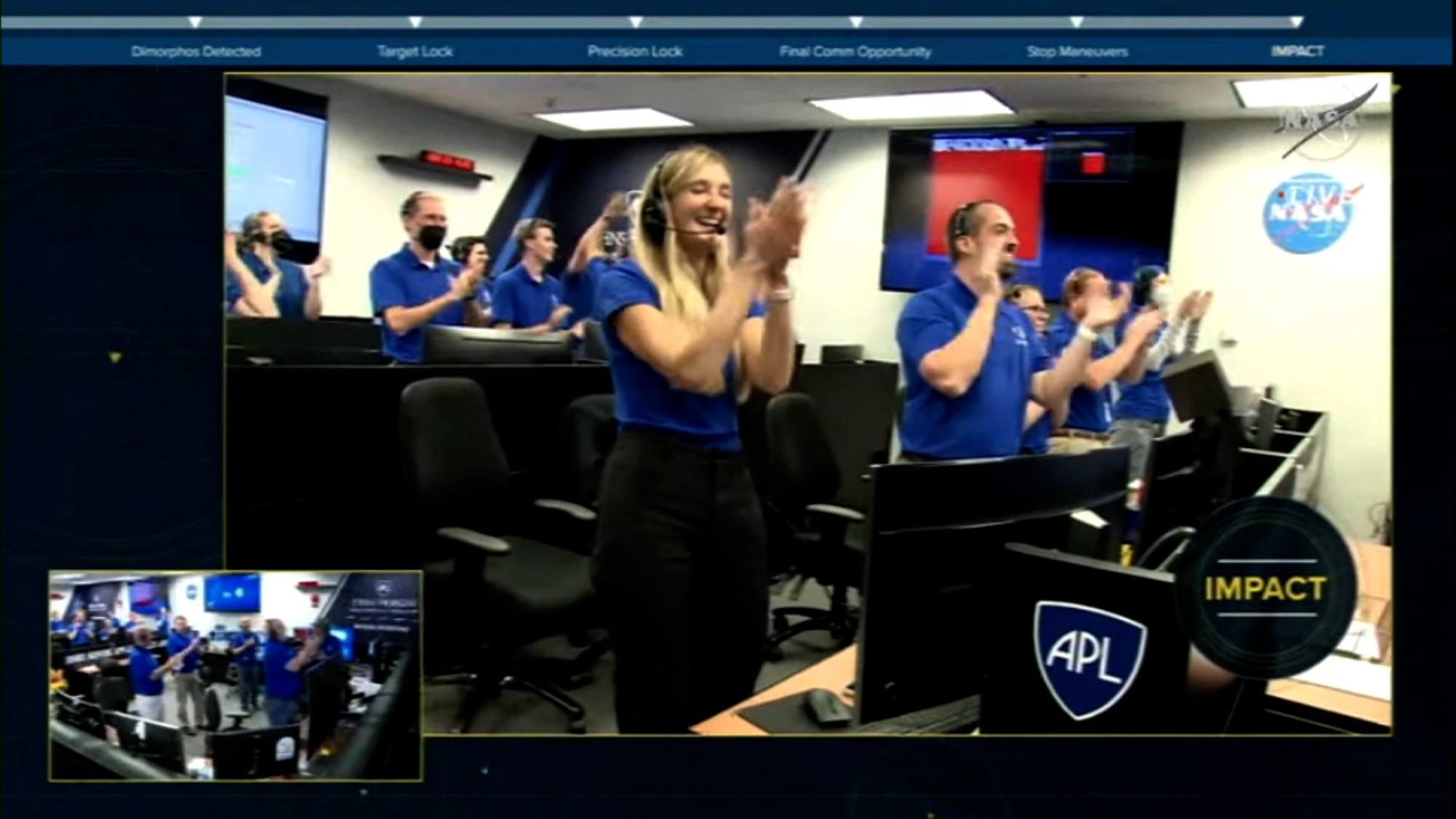 In a screenshot from NASA's DART mission livestream, NASA engineers celebrate after the DART spacecraft collided with Dimorphos on Monday, Sept. 26.