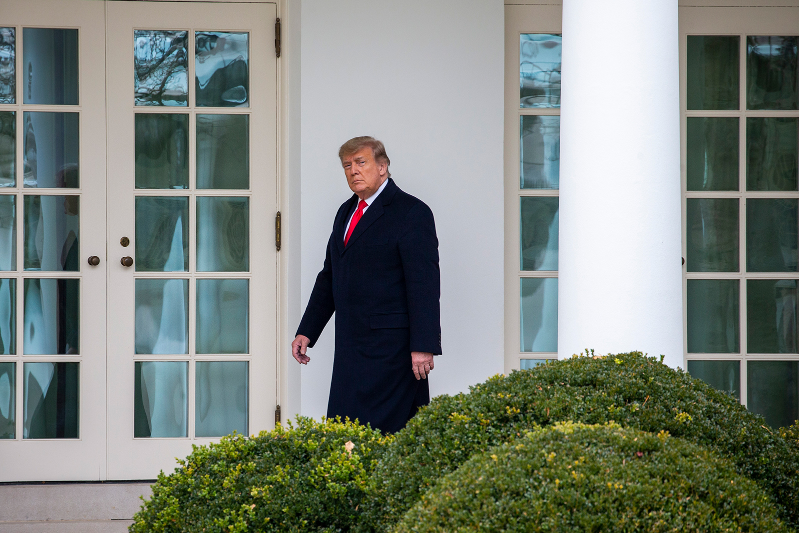 President Donald Trump walks to the Oval Office while arriving back at the White House in Washington, DC, on December 31, 2020.
