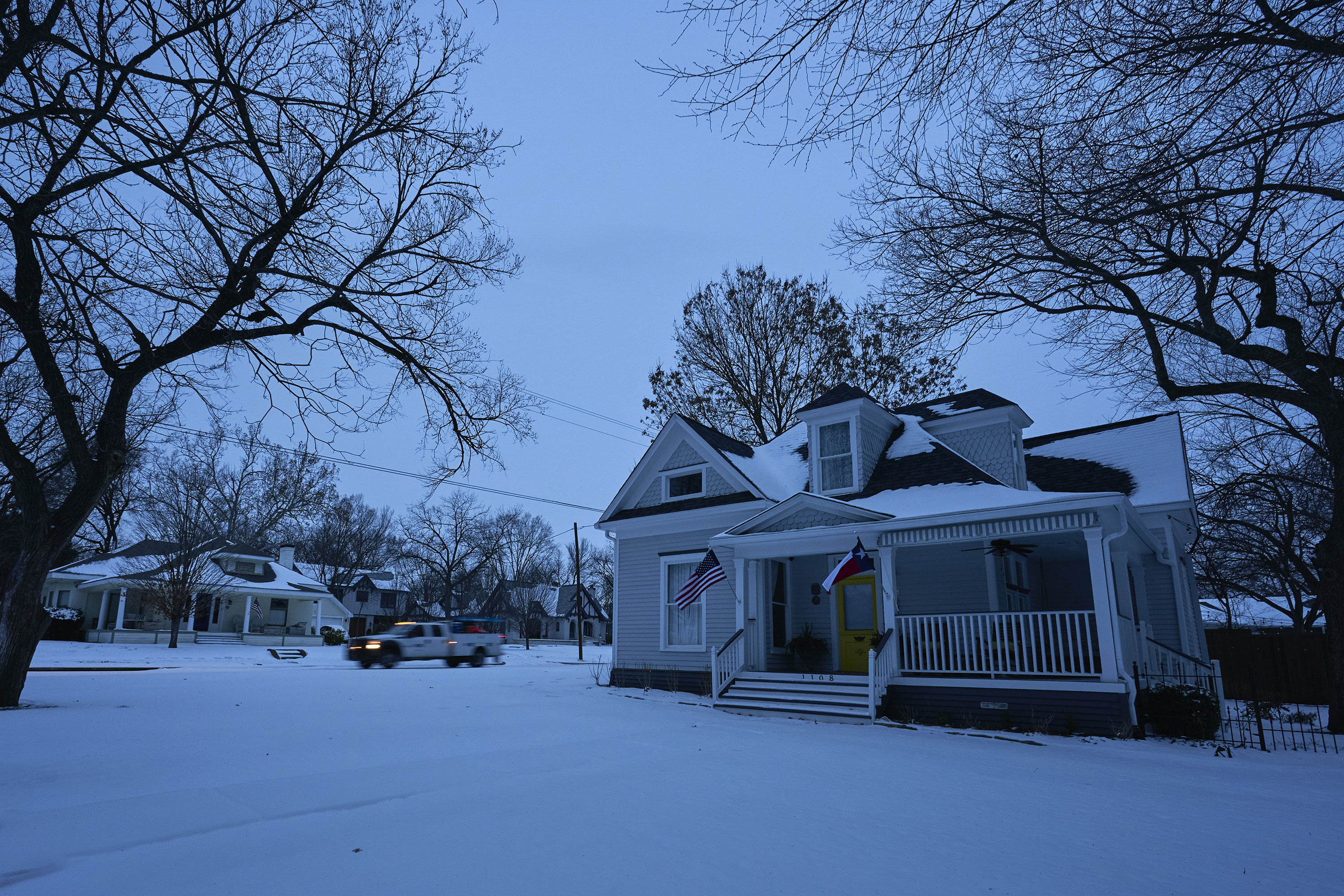 A utilities truck drives down a street in McKinney, Texas, during a power outage on February 16.