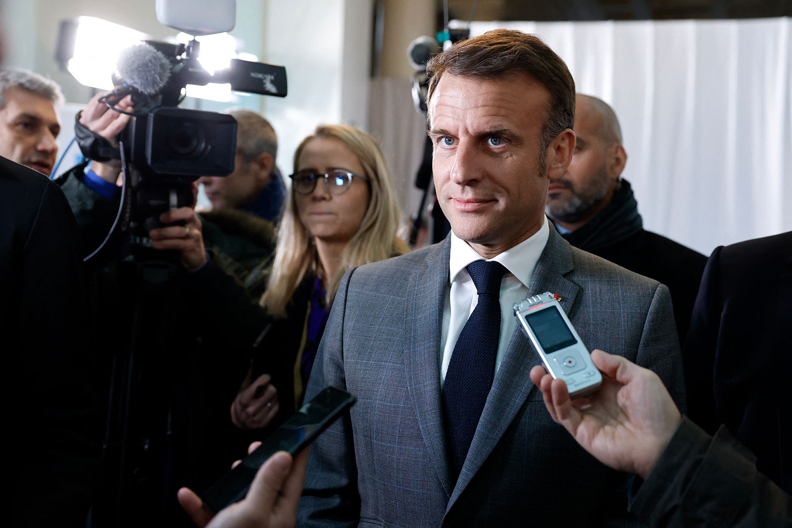 France's President Emmanuel Macron speaks to press at EU headquarters in Brussels on Wednesday.