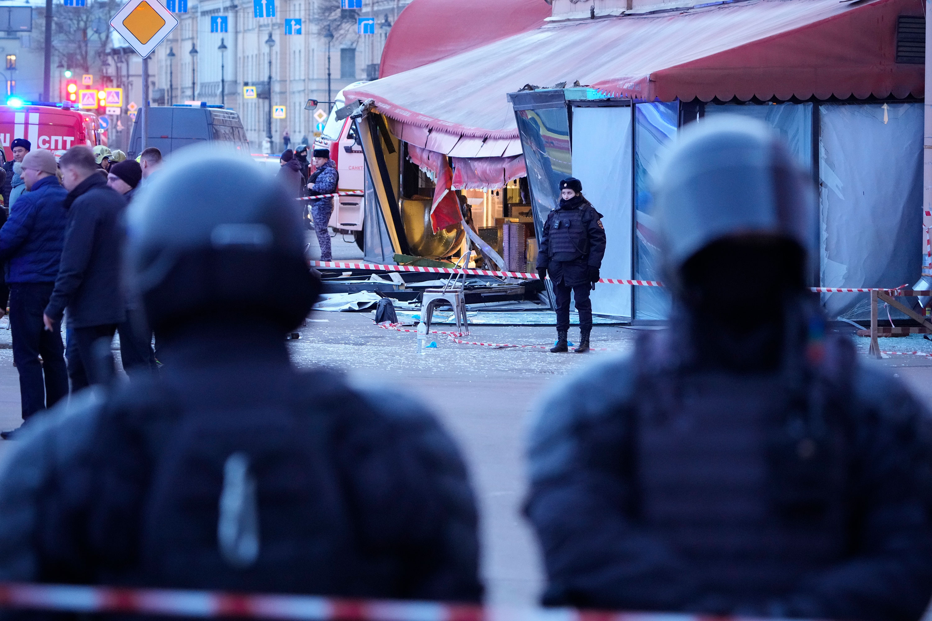 Russian police officers are seen at the site of an explosion at a cafe in St. Petersburg on April 2. 