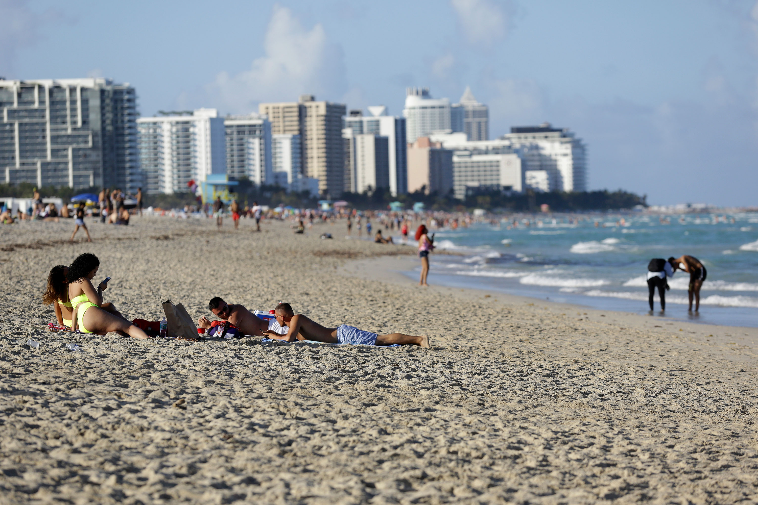 Beachgoers enjoy Miami Beach on March 14.