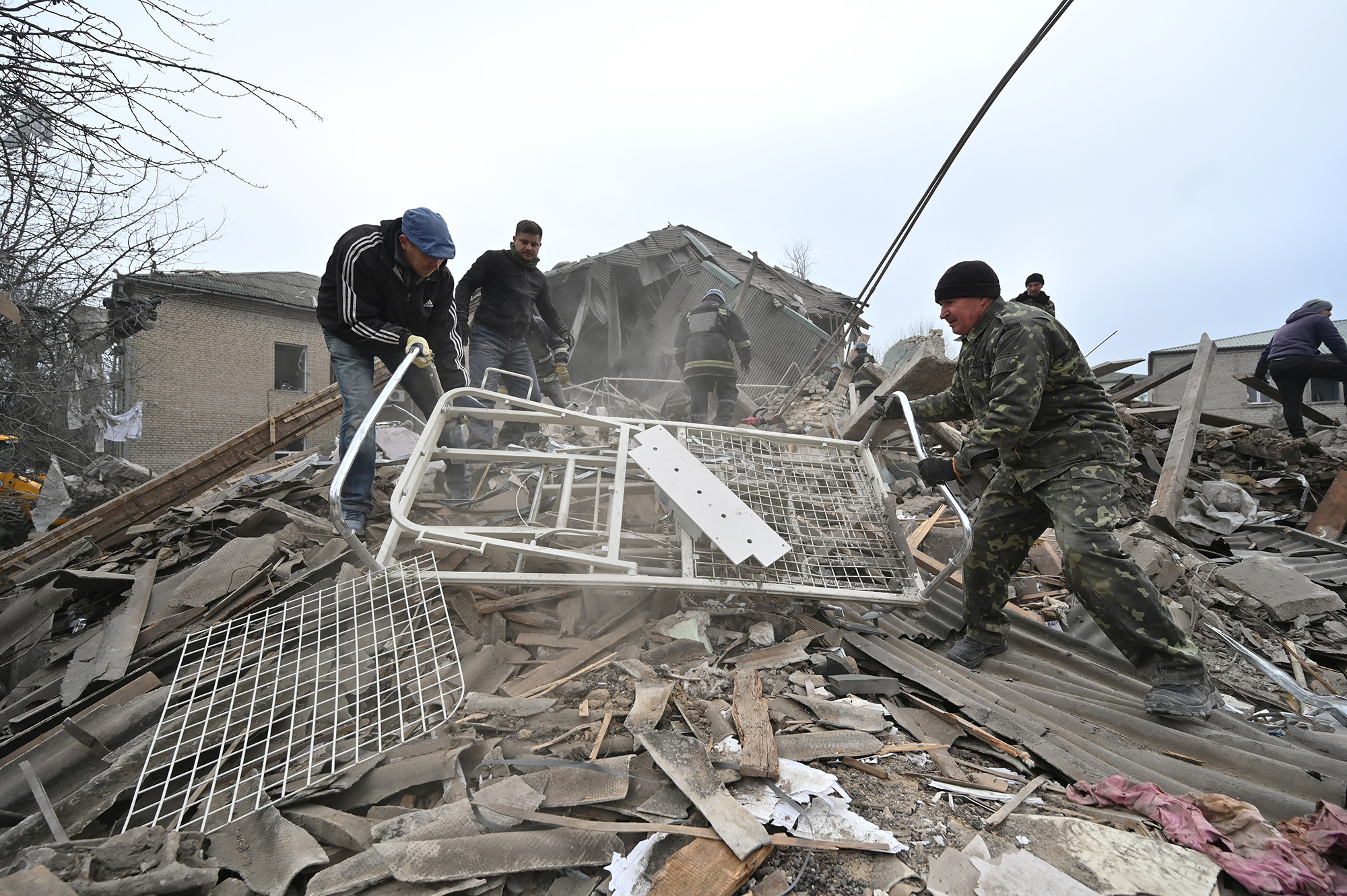 Rescuers work at the site of a maternity ward of a hospital destroyed by a Russian missile attack in Vilniansk, Zaporizhzhia region, Ukraine, on November 23.