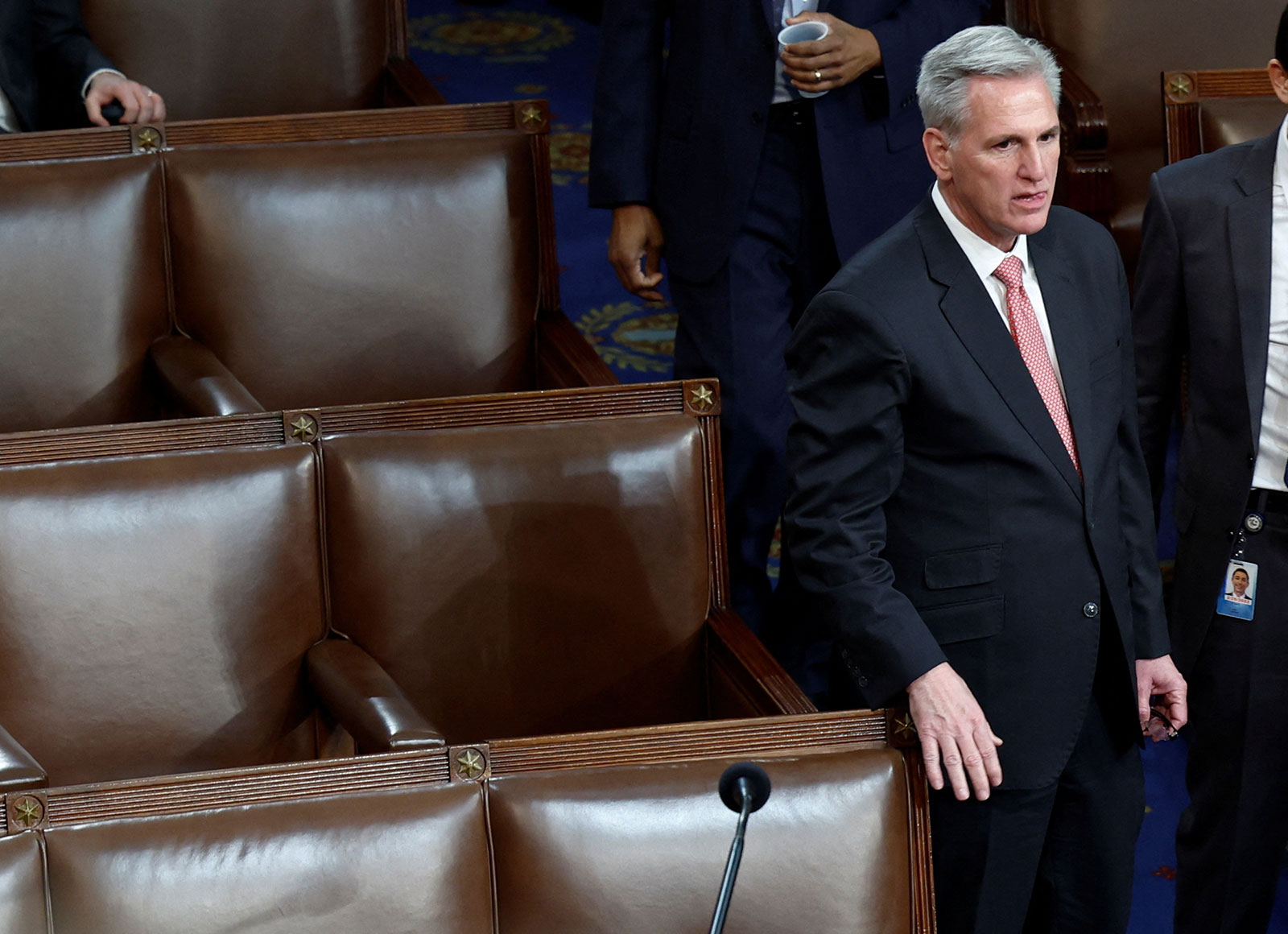 Rep. Kevin McCarthy stands in the center aisle of the House chamber on Thursday.