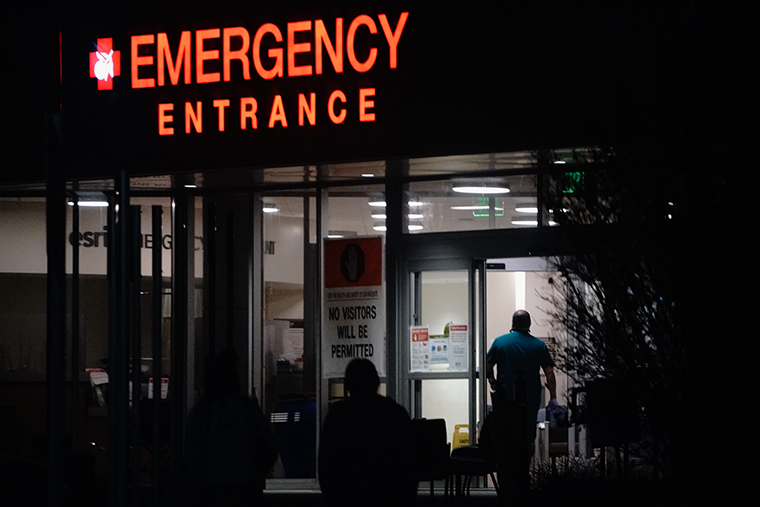 People enter the emergency room at Redlands Community Hospital in Redlands, California, U.S., on Thursday, Dec. 17, 2020.