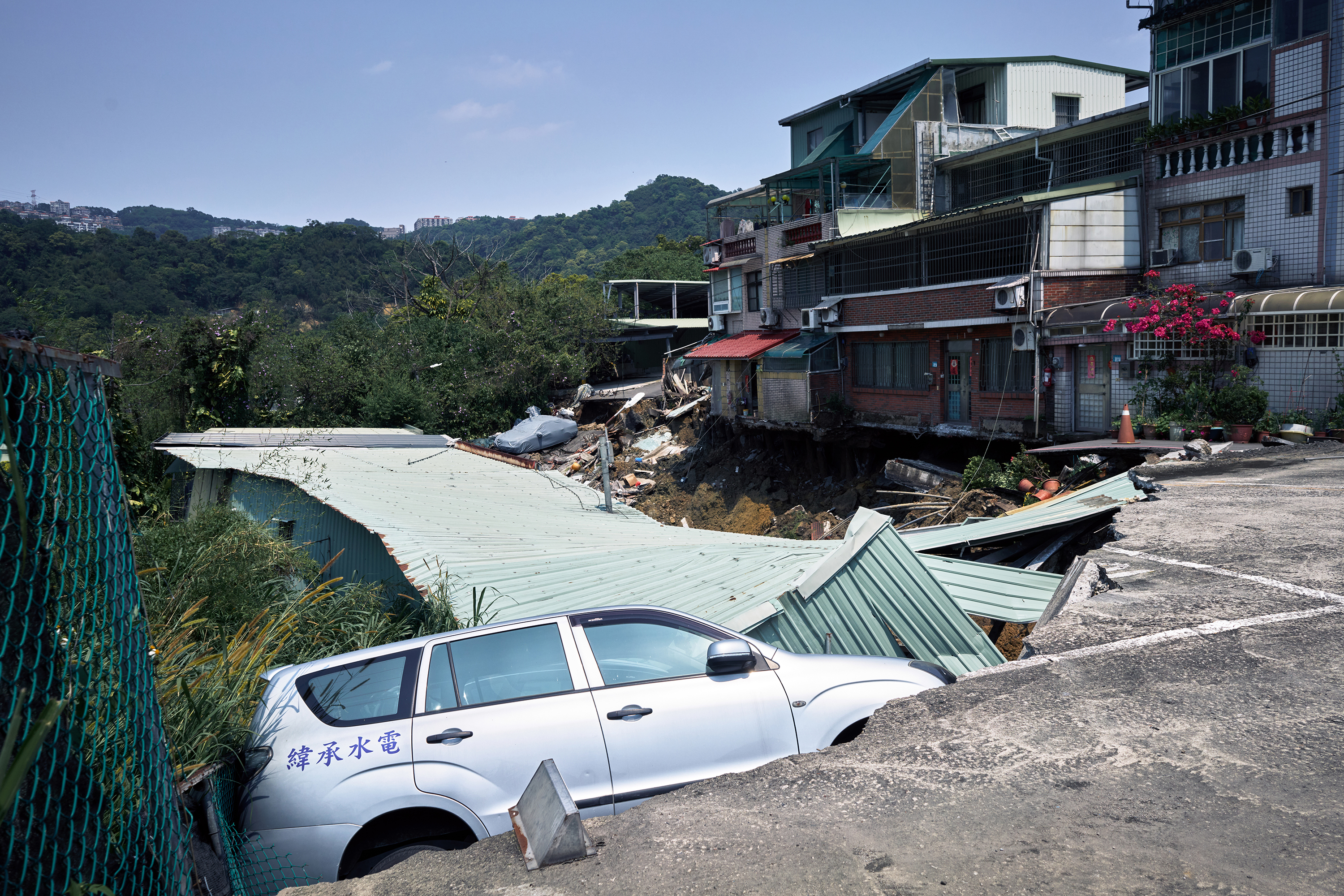 A vehicle in a collapsed road following an earthquake in New Taipei City, Taiwan, on April 3.