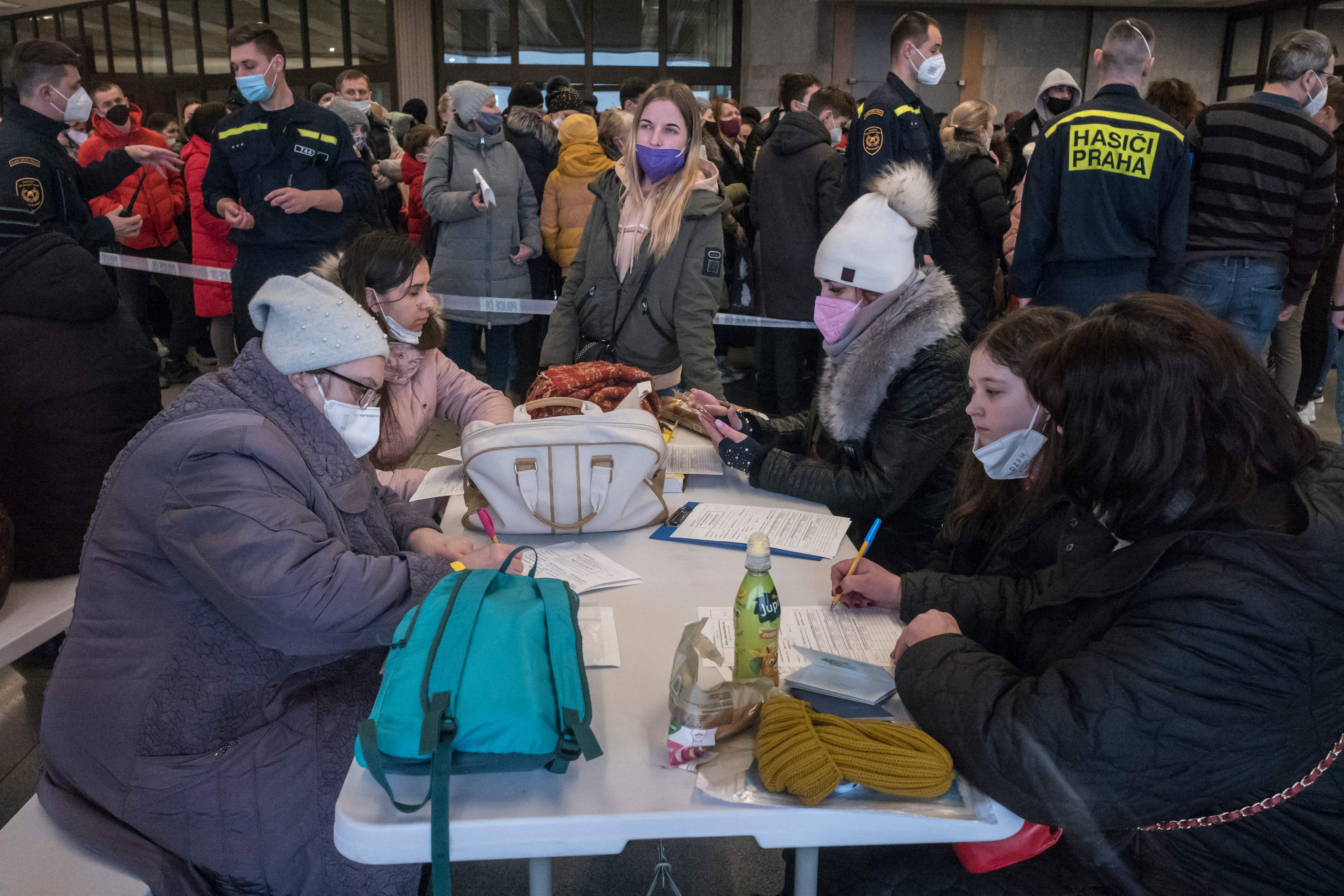 Refugees from Ukraine queue to file for residency permits at the regional assistance centre for refugees in Prague's Congress Centre in Prague, Czech Republic, on March 7.