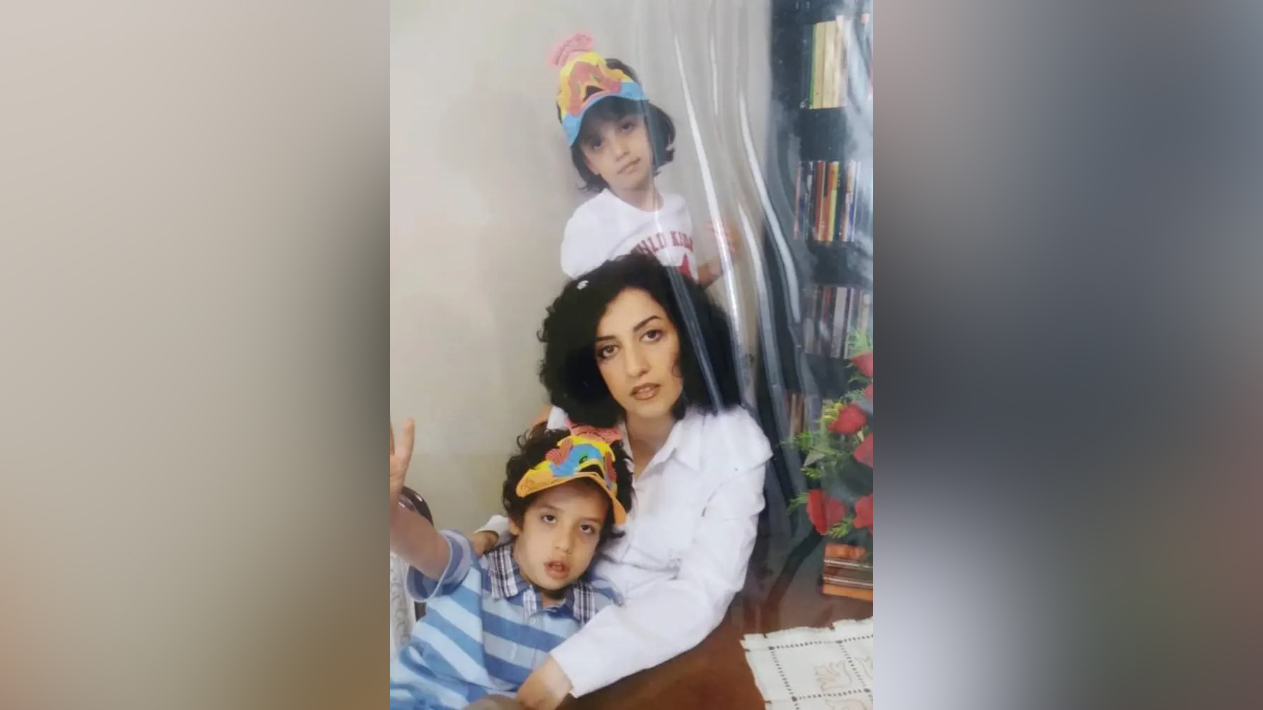 An archival photograph of Narges Mohammadi with her children, Kiana and Ali.