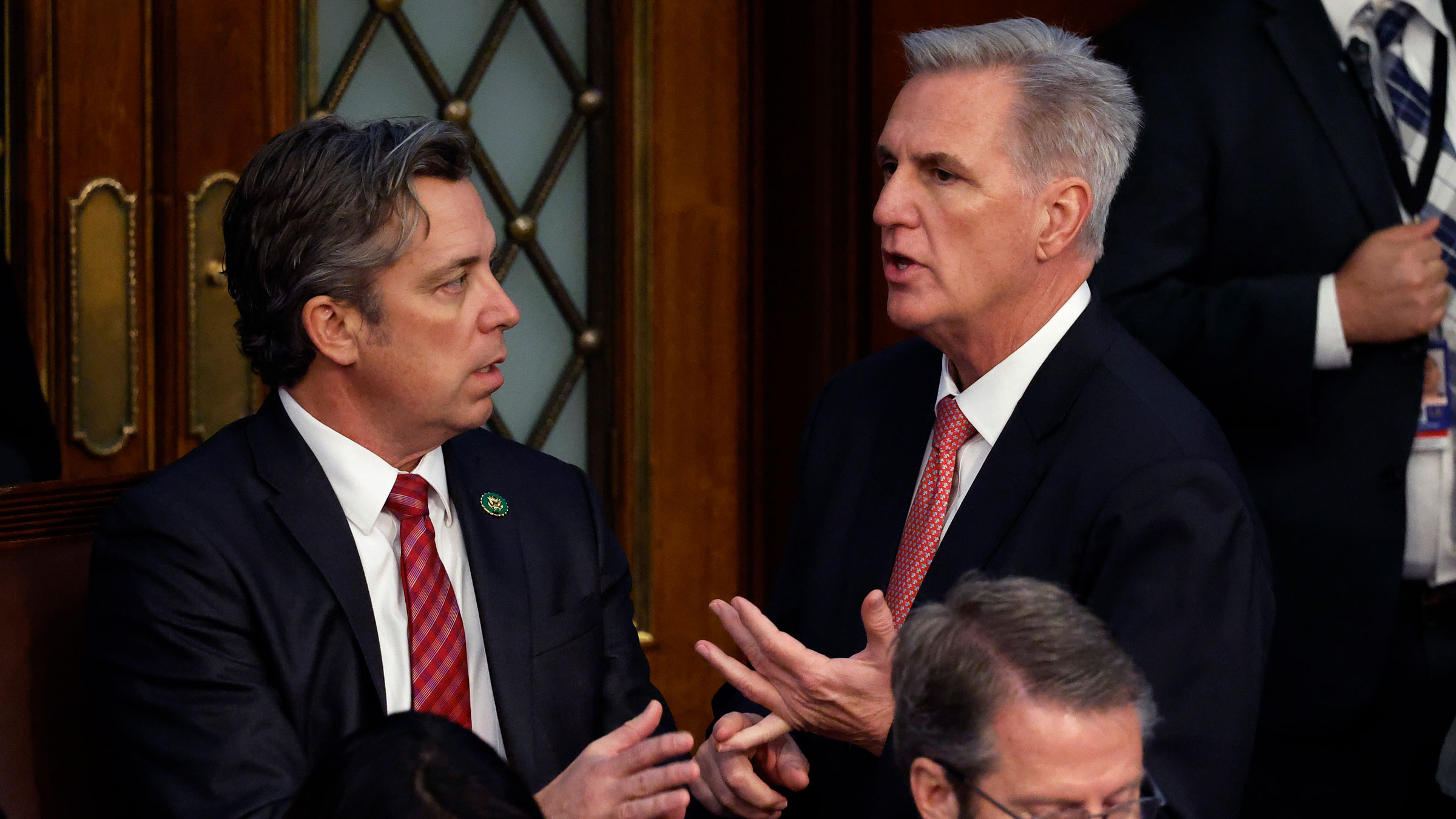 Kevin McCarthy, right, talks to Rep.-elect Andy Ogles, one of the Republicans who has voted against him, on Thursday.