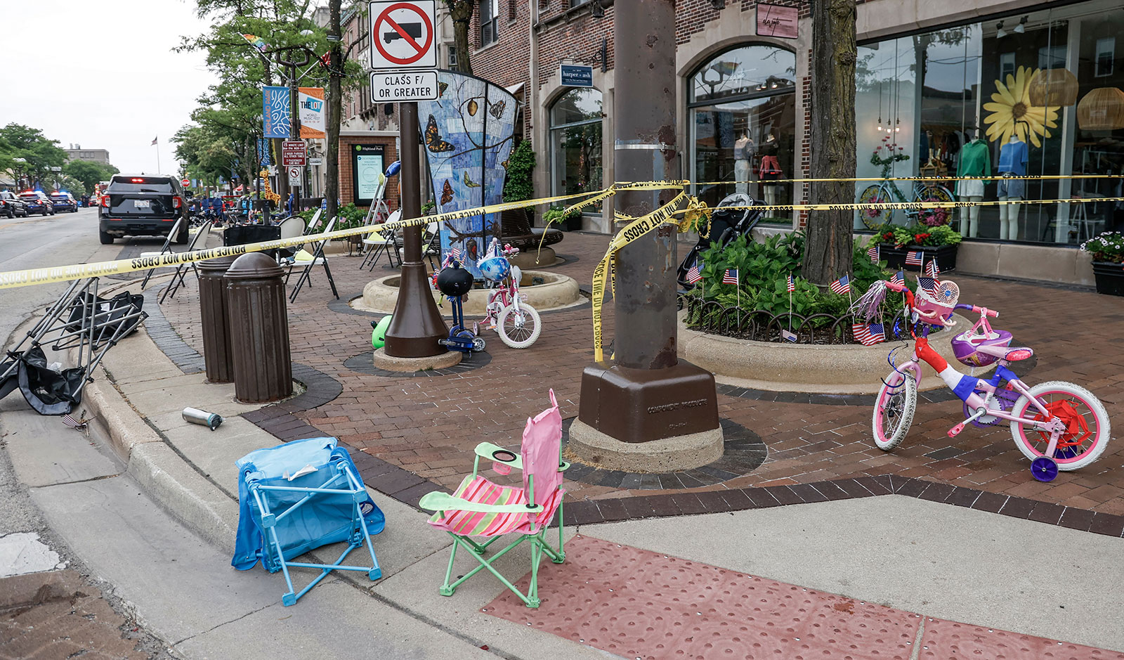 Chairs and bicycles lie abandoned after people fled the scene of a shooting at a July 4th celebration and parade in Highland Park, Illinois on July 4.