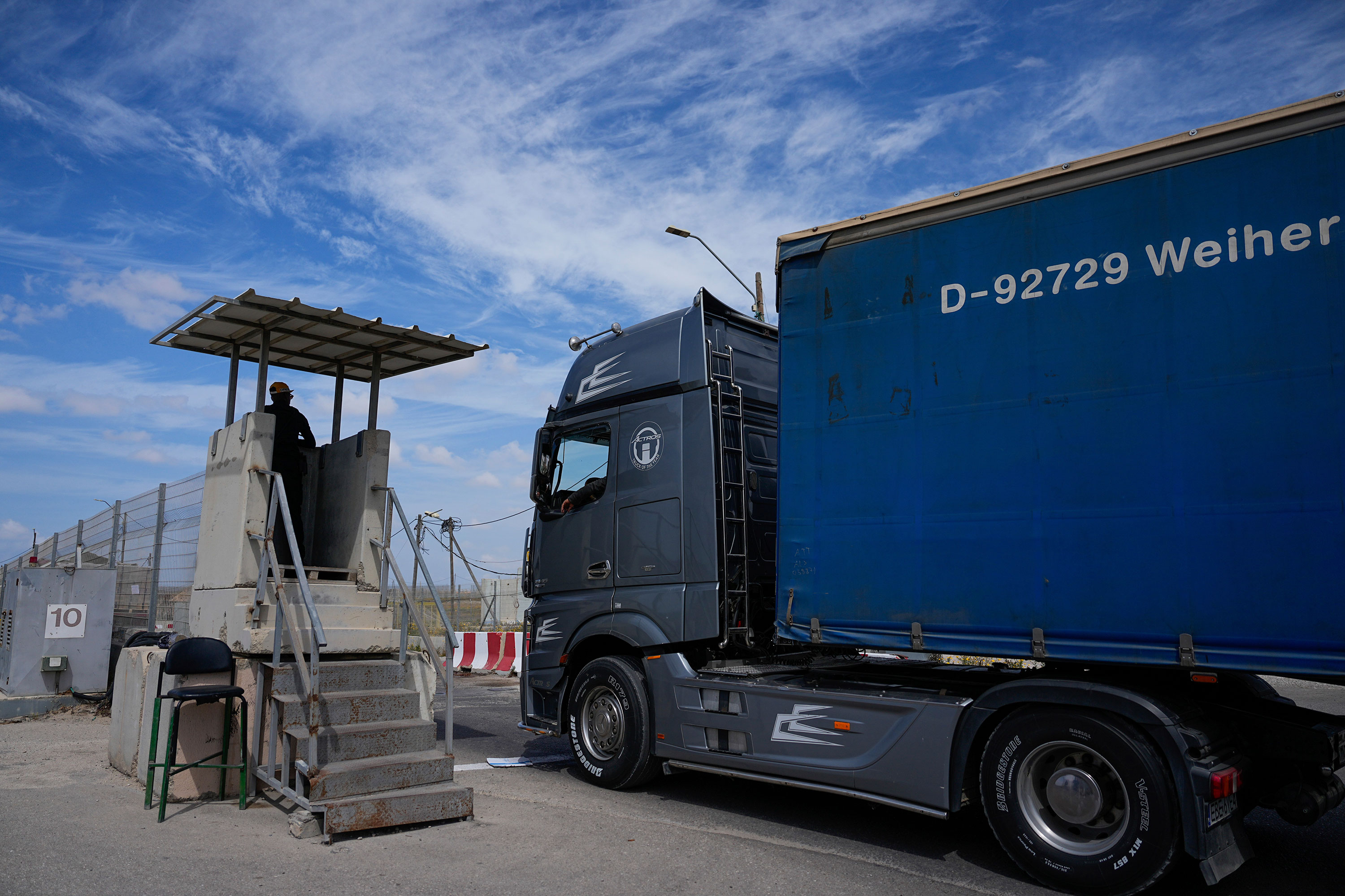 A truck carrying humanitarian aid for Gaza passes through the Kerem Shalom Crossing in southern Israel on March 14. 