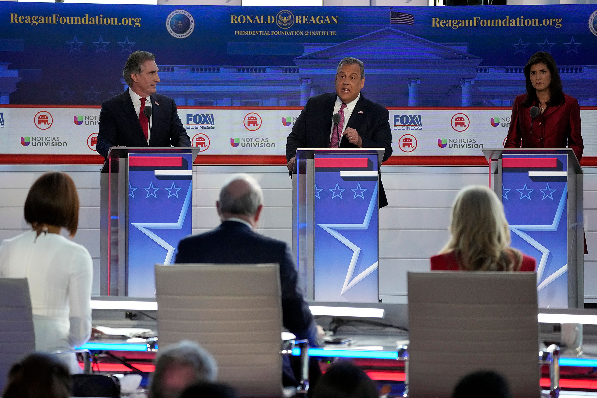 Former New Jersey Gov. Chris Christie, center, argues a point during a Republican presidential primary debate hosted by FOX Business Network and Univision on Wednesday at the Ronald Reagan Presidential Library.
