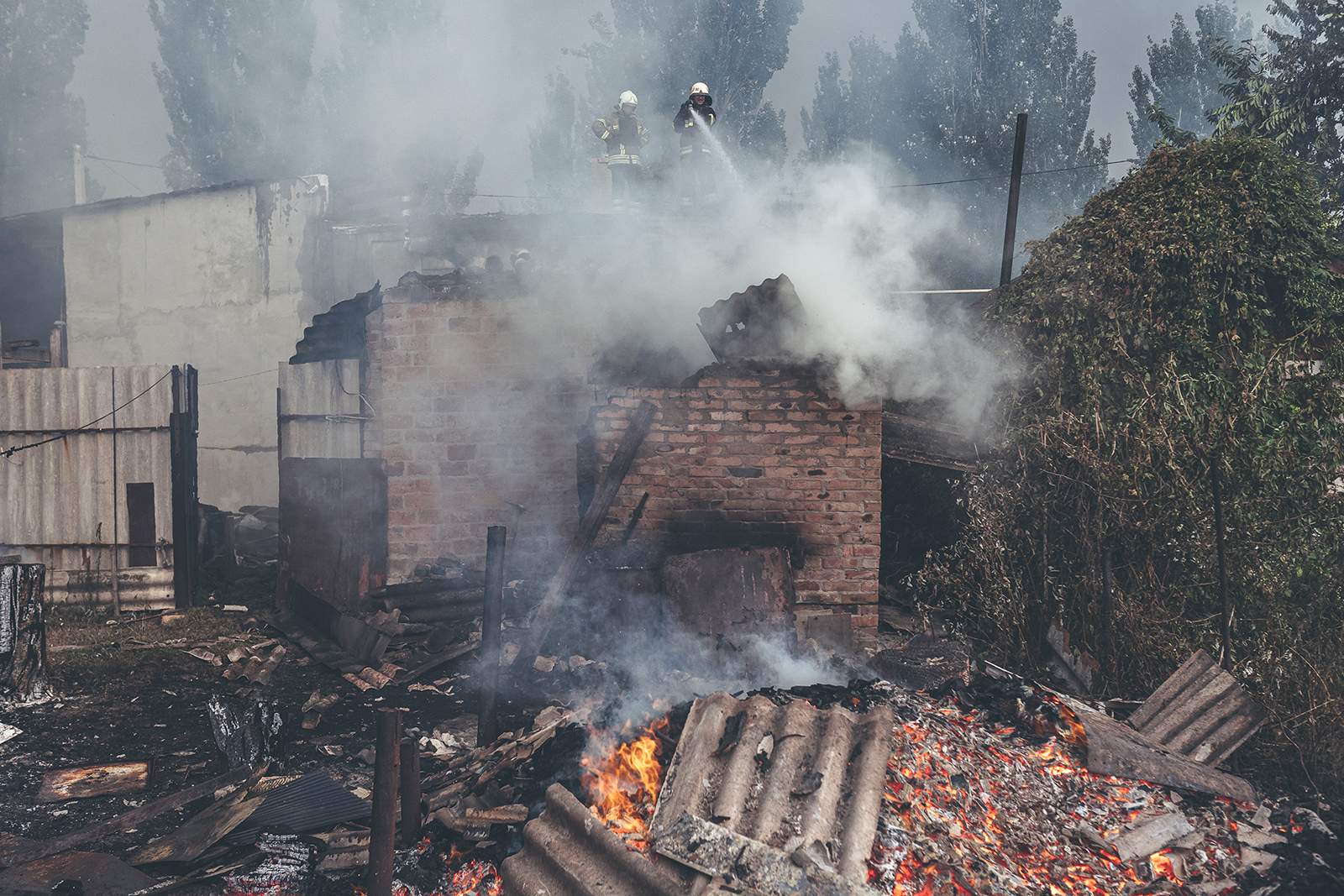 Firefighters extinguish a fire that broke out after shelling in Opytne, Donetsk Oblast, Ukraine, on August 1.