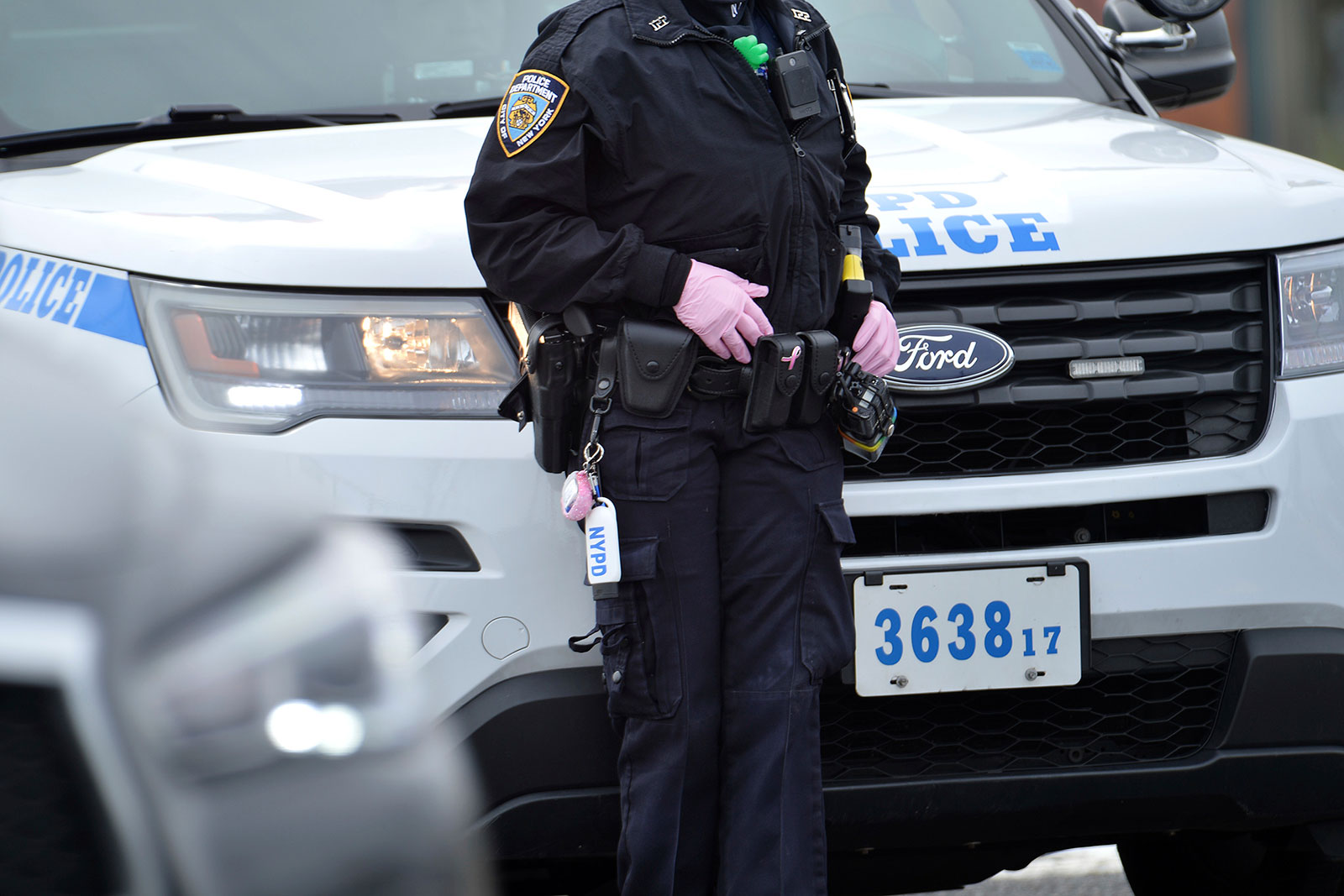 An NYPD officer helps direct traffic at a coronavirus testing center in Staten Island, New York, on March 19.