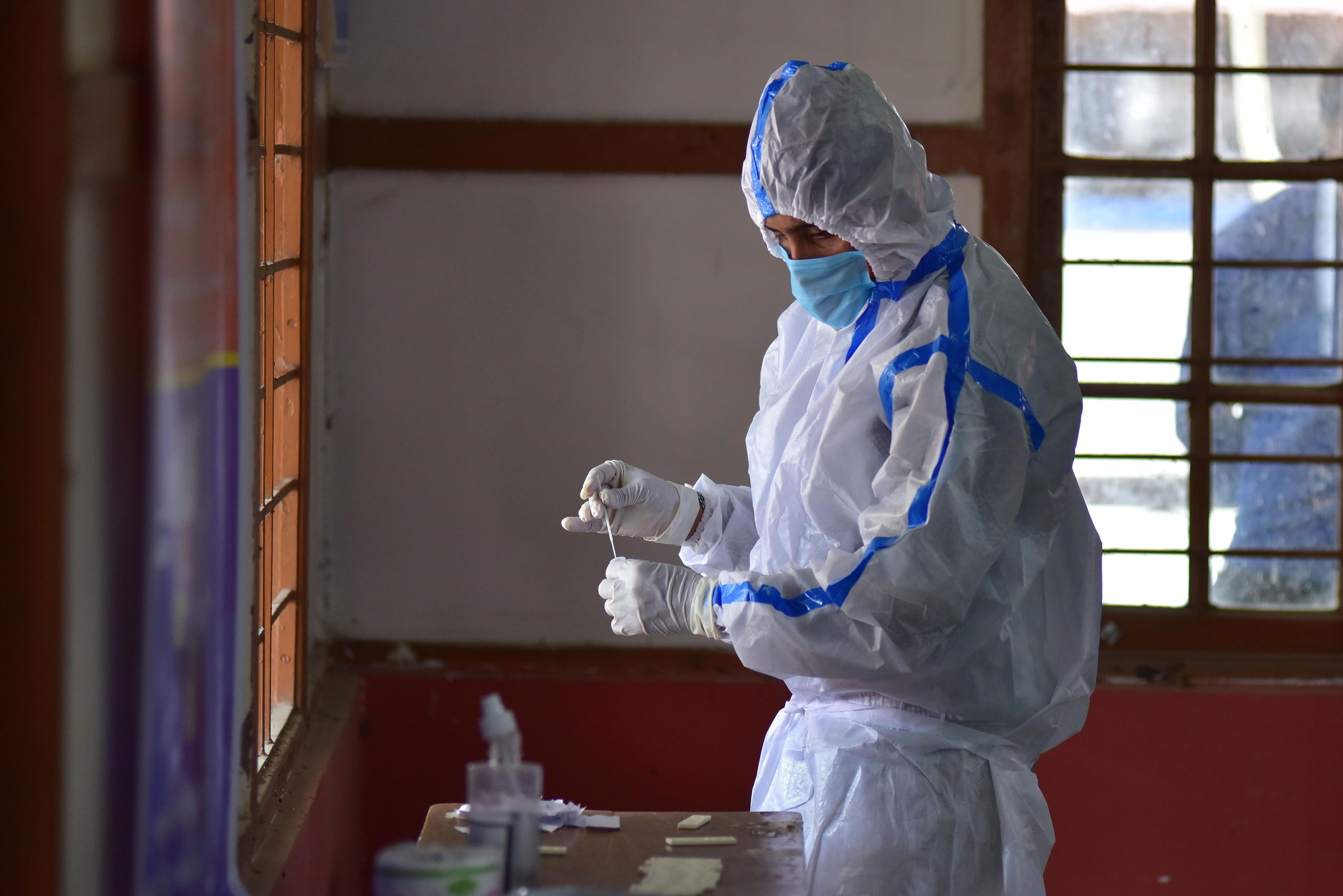 A health worker conducts a rapid antigen test for Covid-19 in Nagaon, India, on May 27.