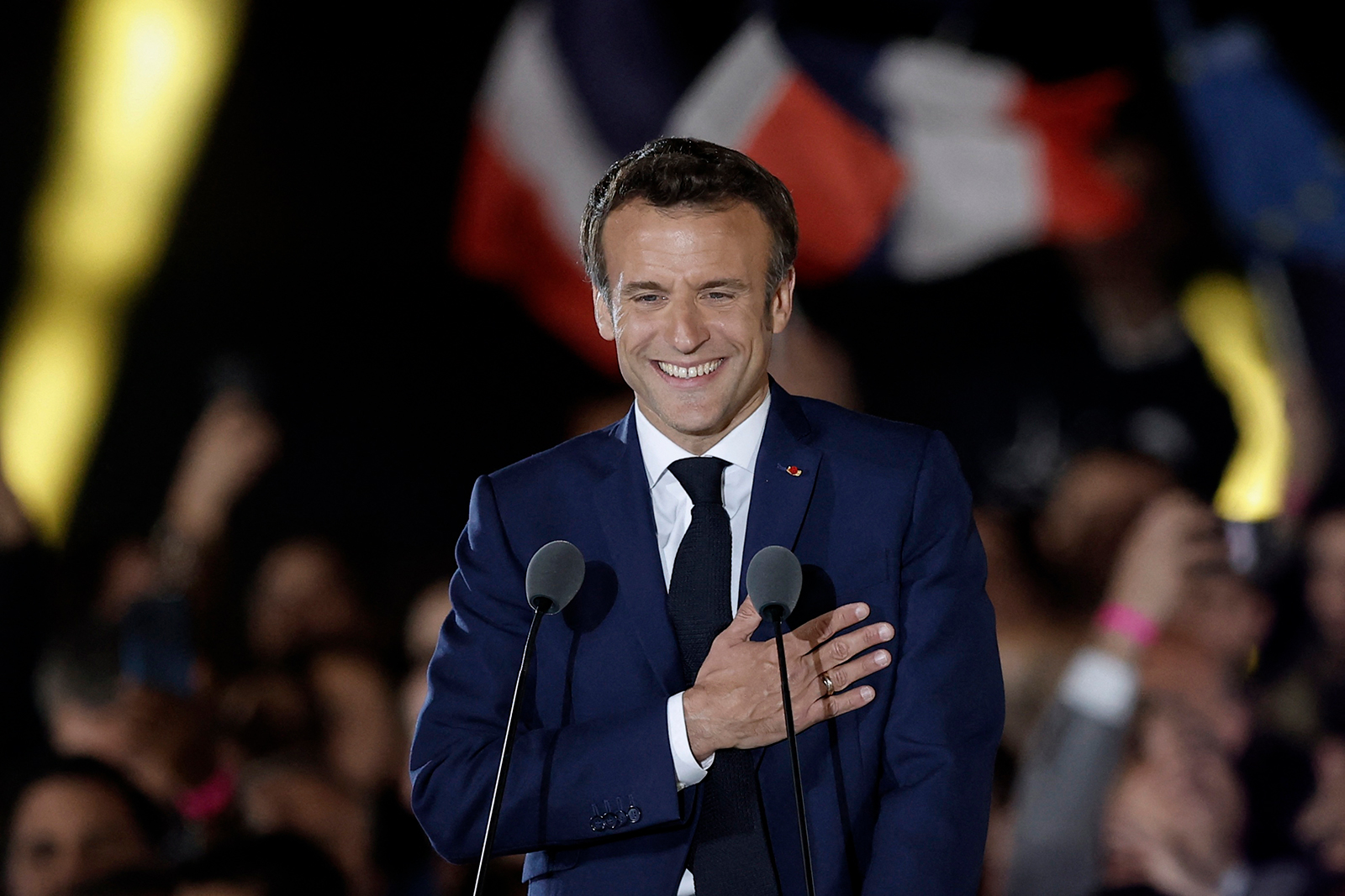 Emmanuel Macron gestures as he arrives to deliver a speech at his victory rally at the Champs de Mars in Paris on April 24.