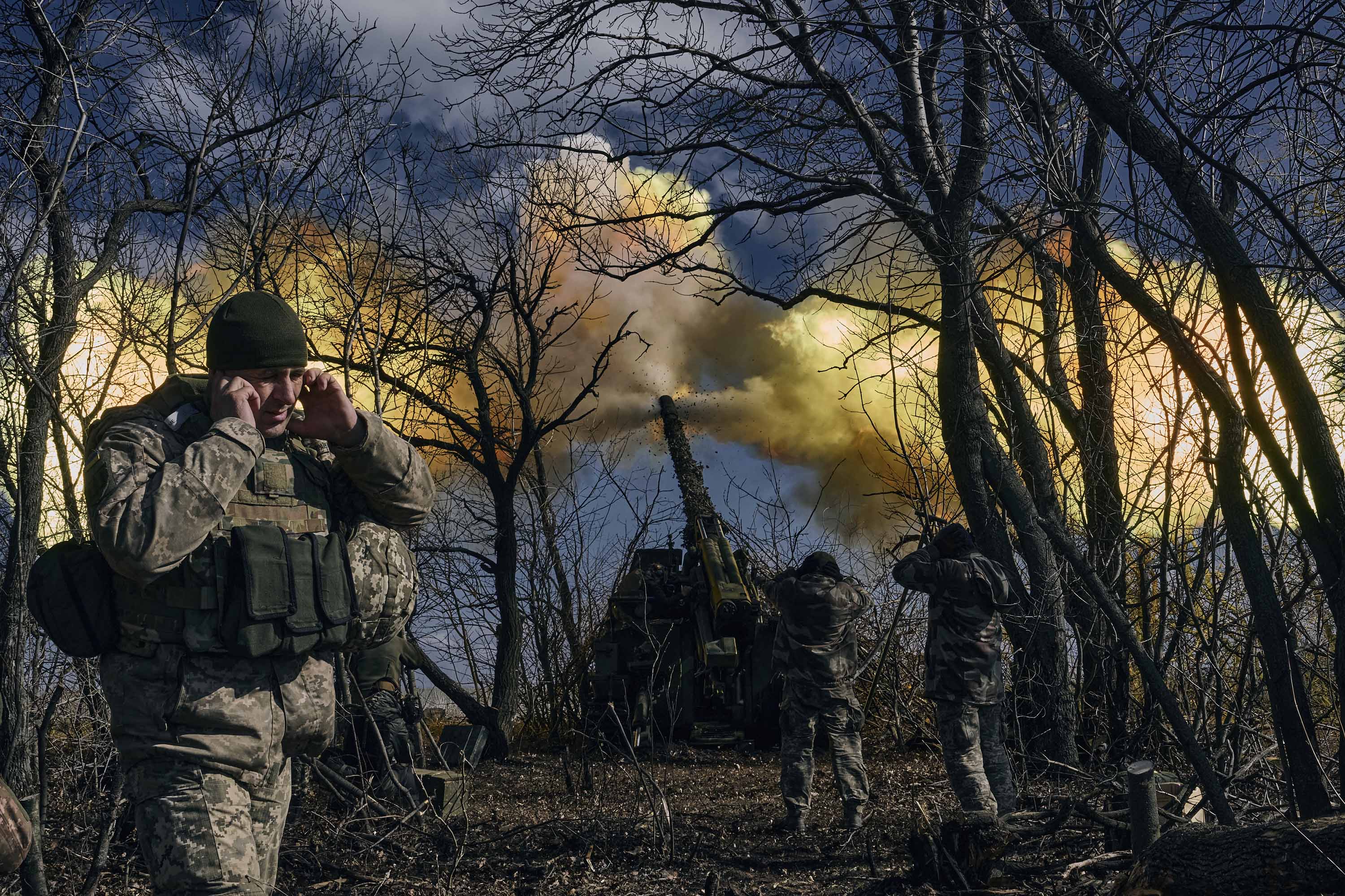 Ukrainian soldiers fire a self-propelled howitzer towards Russian positions near Bakhmut, Ukraine, on Sunday, March 5. 