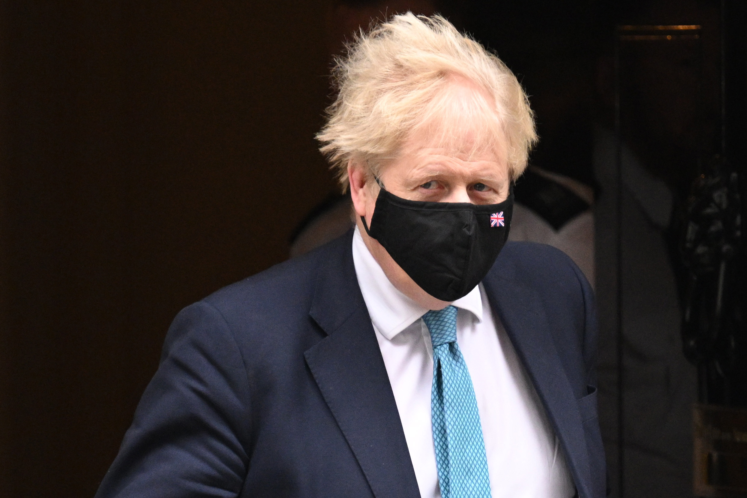 British Prime Minister Boris Johnson leaves 10 Downing Street to attend the weekly PMQs in the House of Commons on January 26 in London, England.