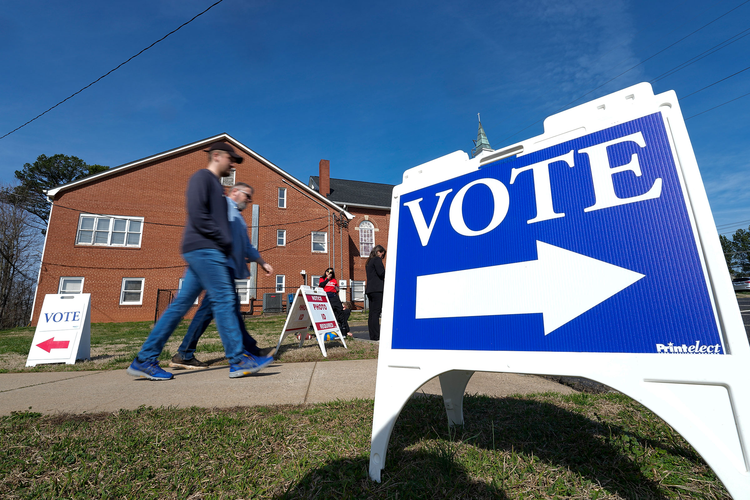 Super Tuesday voters leave a polling location Tuesday, March 5, in Mount Holly, North Carolina.