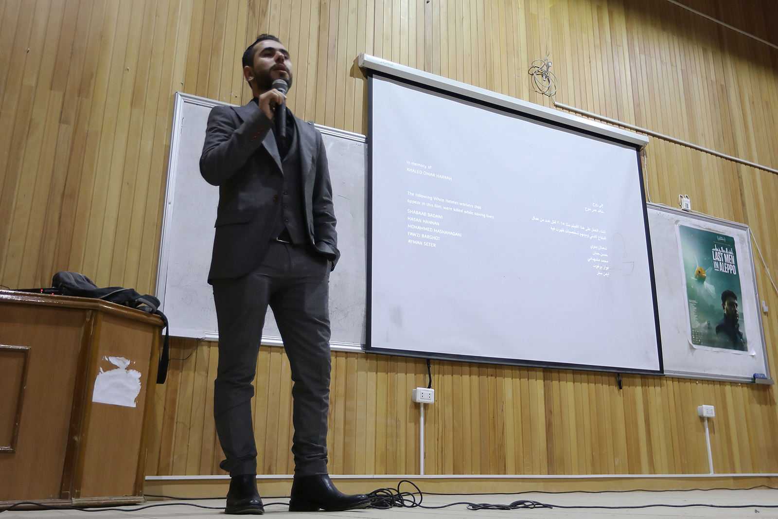 Syrian filmmaker Fadi Al-Halabi speaks on stage following the screening of the Oscar-nominated film "Last Men in Aleppo" at a university in Idlib, Syria on February 12, 2018.