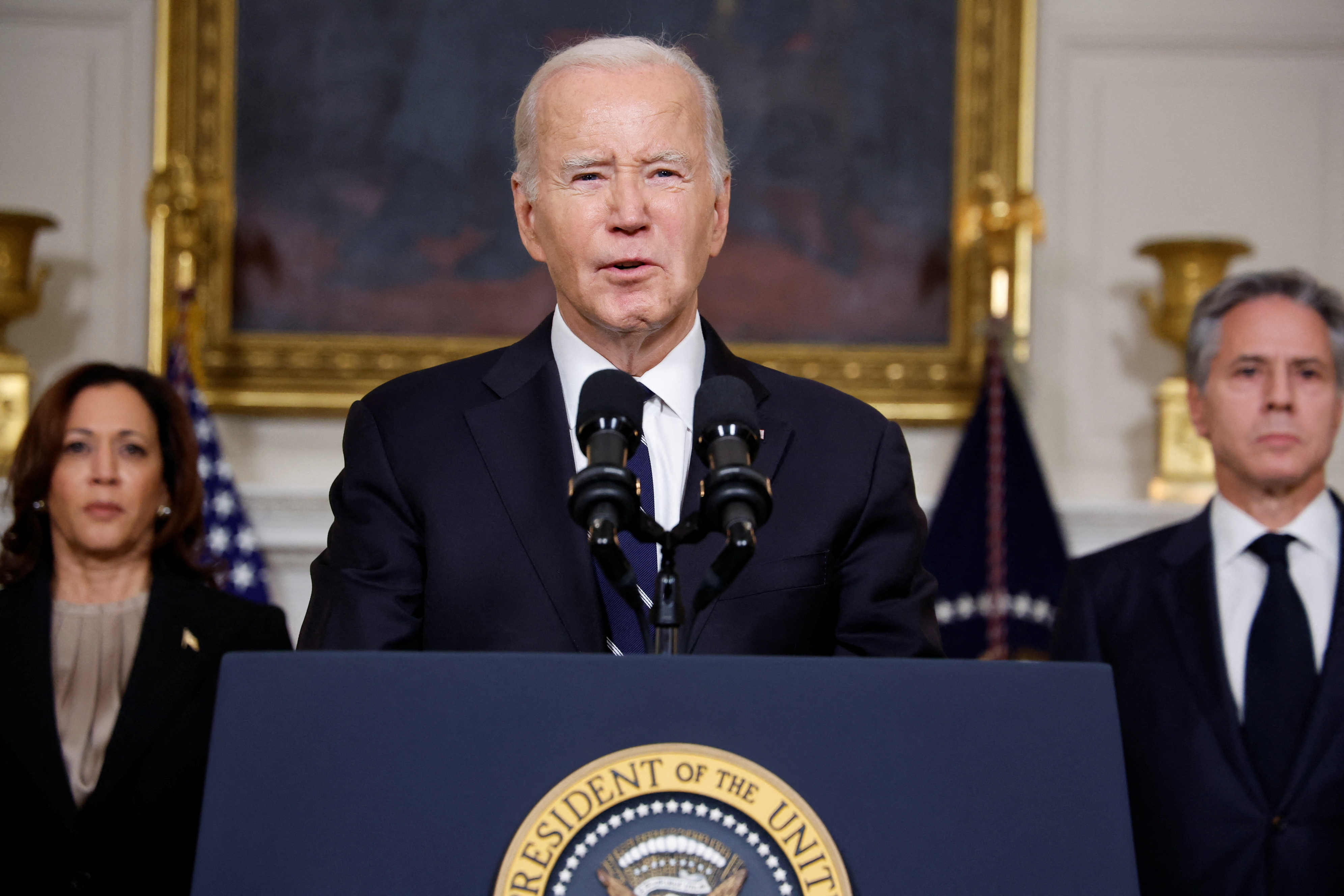 U.S. President Joe Biden, accompanied by Vice President Kamala Harris and U.S. Secretary of State Antony Blinken, makes remarks after speaking by phone with Israeli Prime Minister Benjamin Netanyahu about the situation in Israel following Hamas' deadly attacks, from the State Dining Room at the White House in Washington, DC, on October 10, 2023.