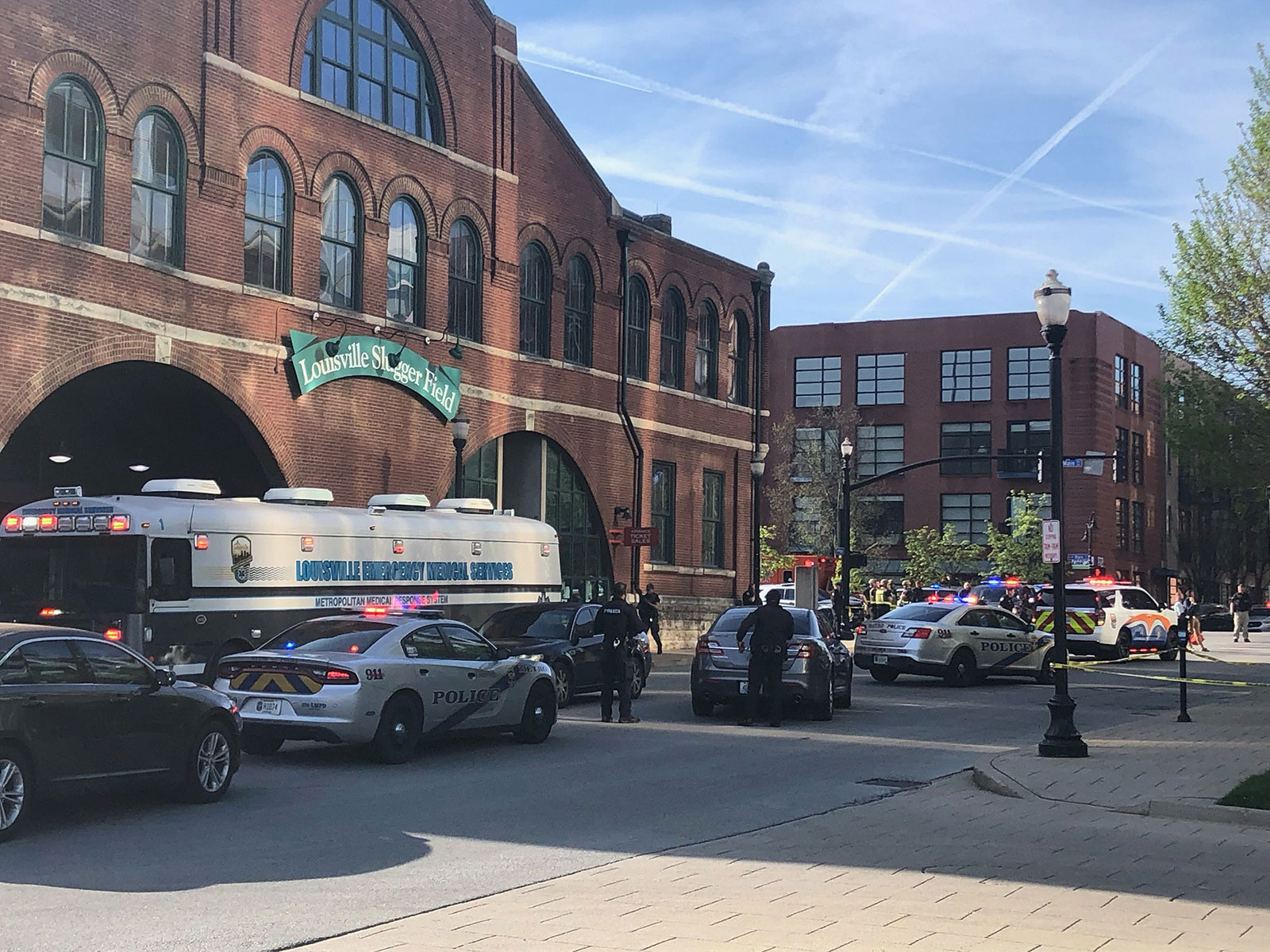 Louisville Metro Police work the scene of a shooting situation in downtown Louisville on Monday.