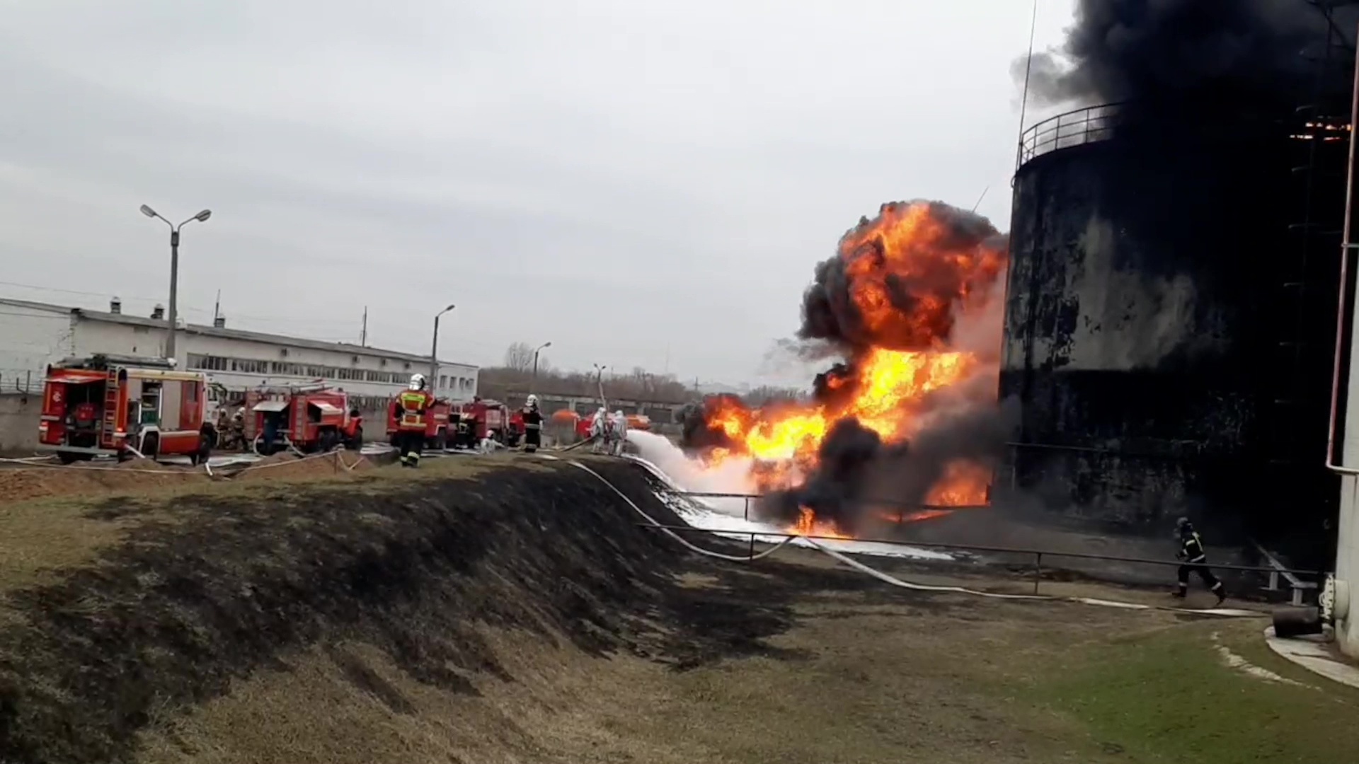 A screen grab captured from a video shows firefighters responding to a fire at a fuel depot in the Russian city of Belgorod on April 1.