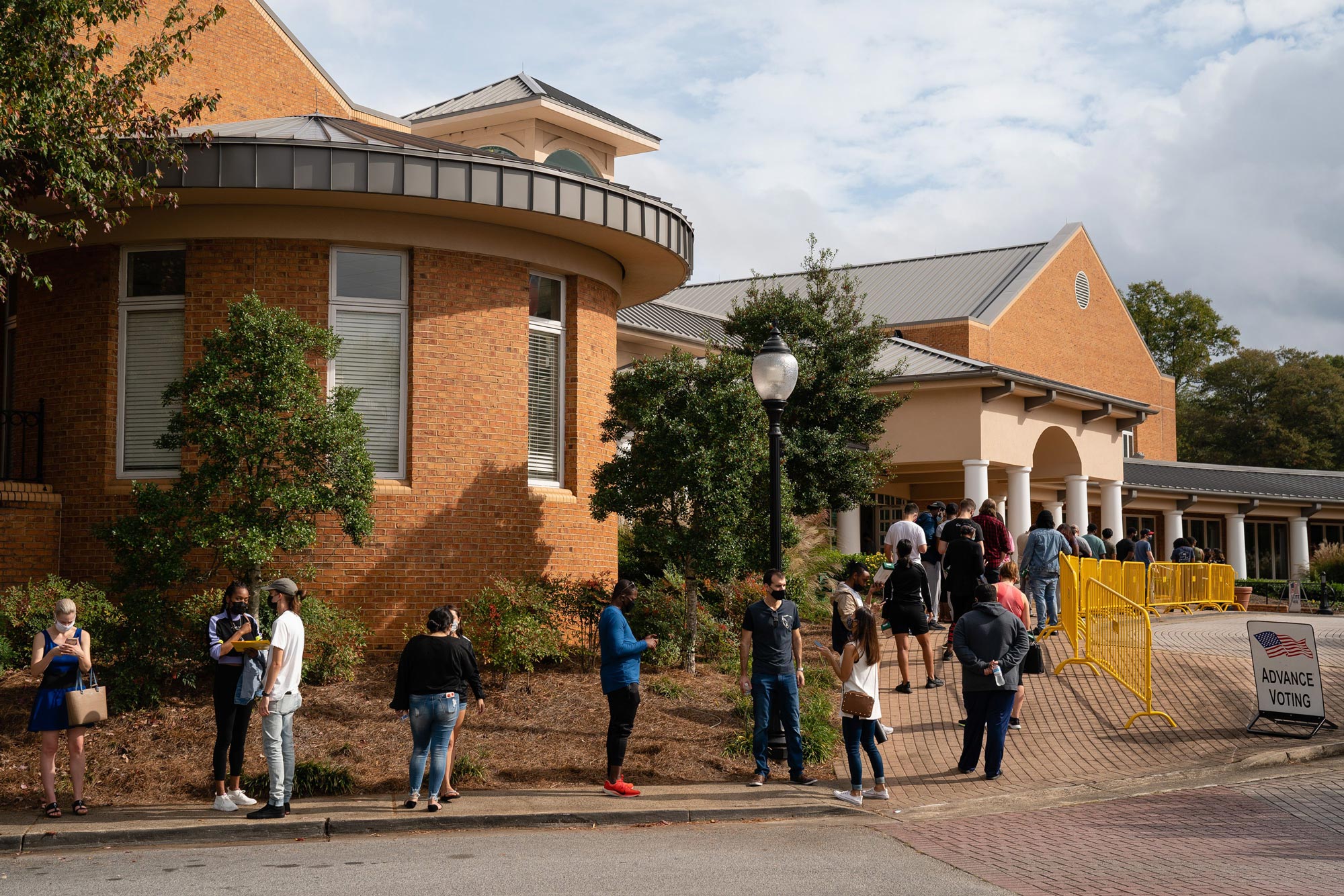 People wait in line to cast their ballots at Smyrna Community Center on October 24 in Smyrna, Georgia. 