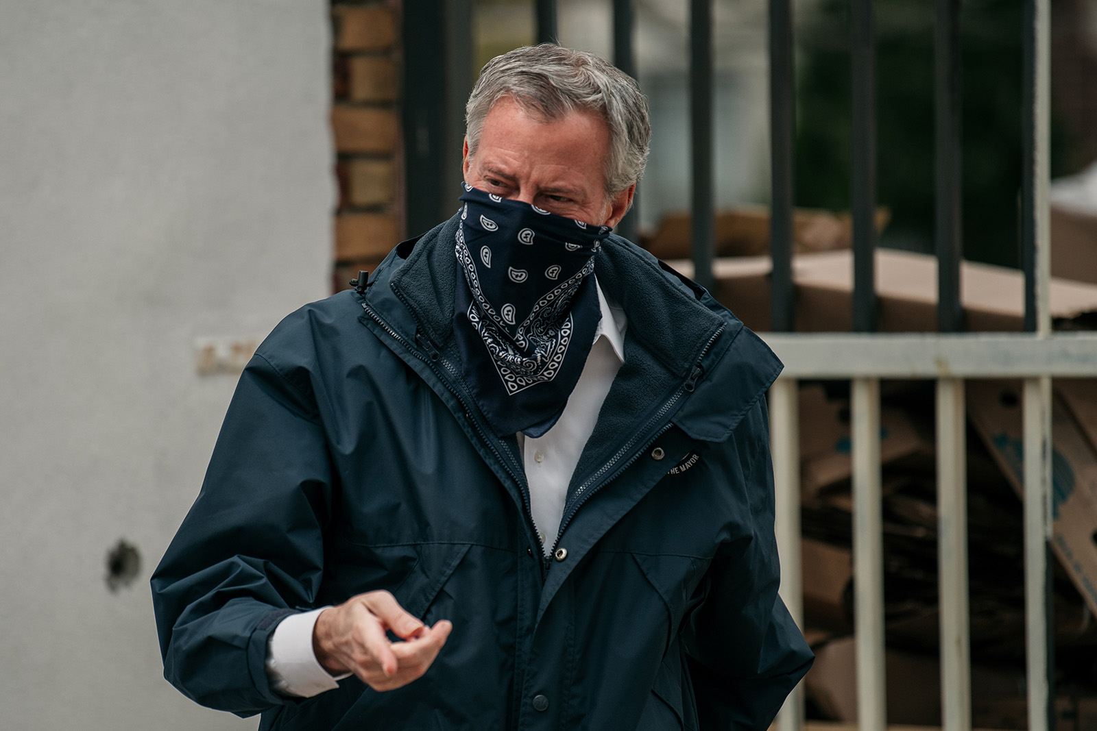 In this April 14, 2020 file photo, New York City Mayor Bill de Blasio wears a bandana over his face while speaking at a food shelf organized by The Campaign Against Hunger in Bed Stuy, Brooklyn.