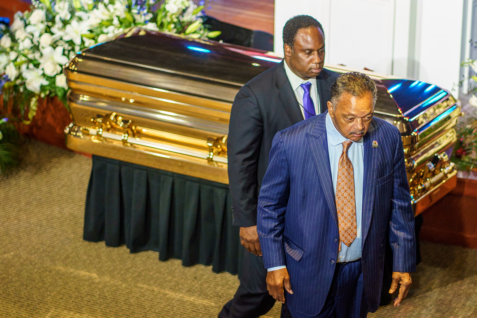 Reverend Jesse Jackson (Right) and his son Jonathan Jackson pay their respects to George Floyd during a memorial service in his honor at North Central University's Frank J. Lindquist Sanctuary in Minneapolis, on June 4.