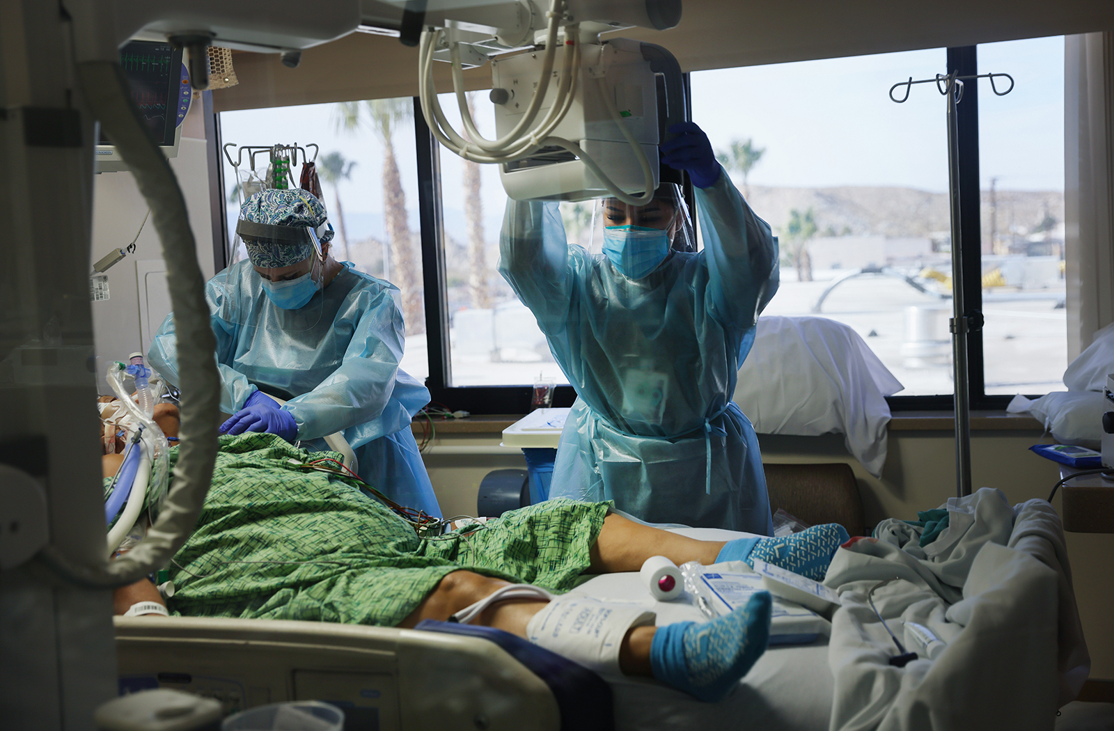 Clinicians care for a Covid-19 patient in the Intensive Care Unit at Providence St. Mary Medical Center on December 23, 2020 in Apple Valley, California. 
