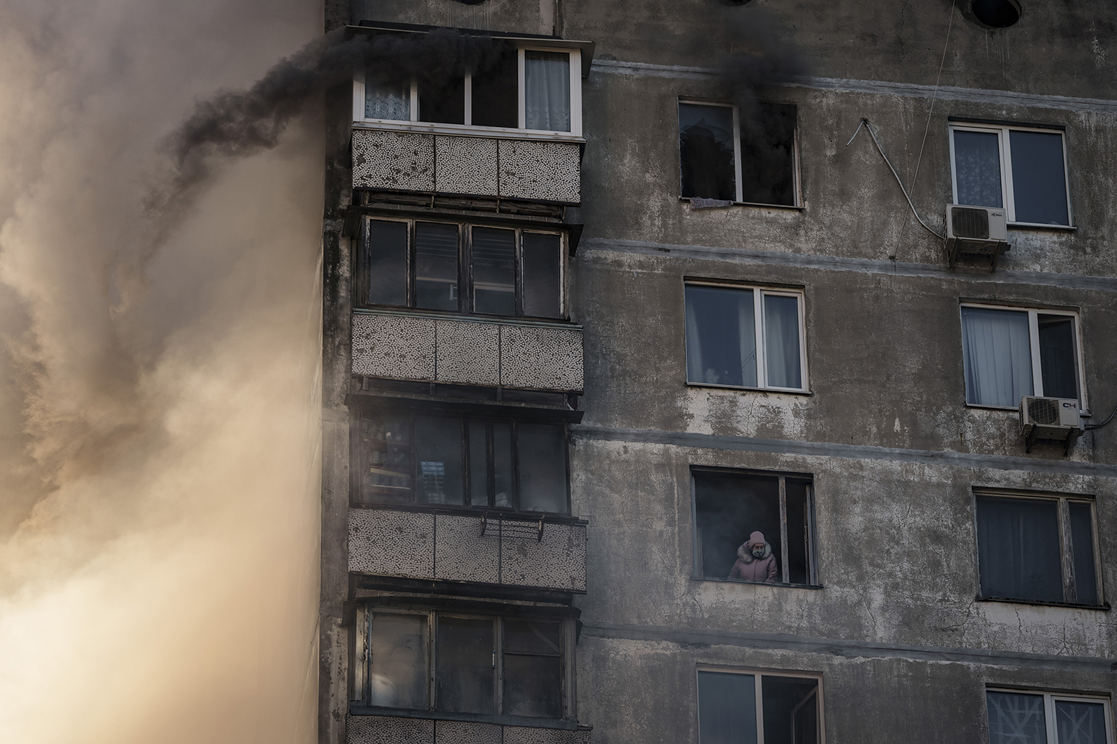 An elderly resident waits to be rescued by firefighters after an apartment building was hit by shelling in Kyiv, Ukraine, on March 15.