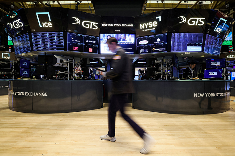 Traders work on the floor of the New York Stock Exchange on March 28.