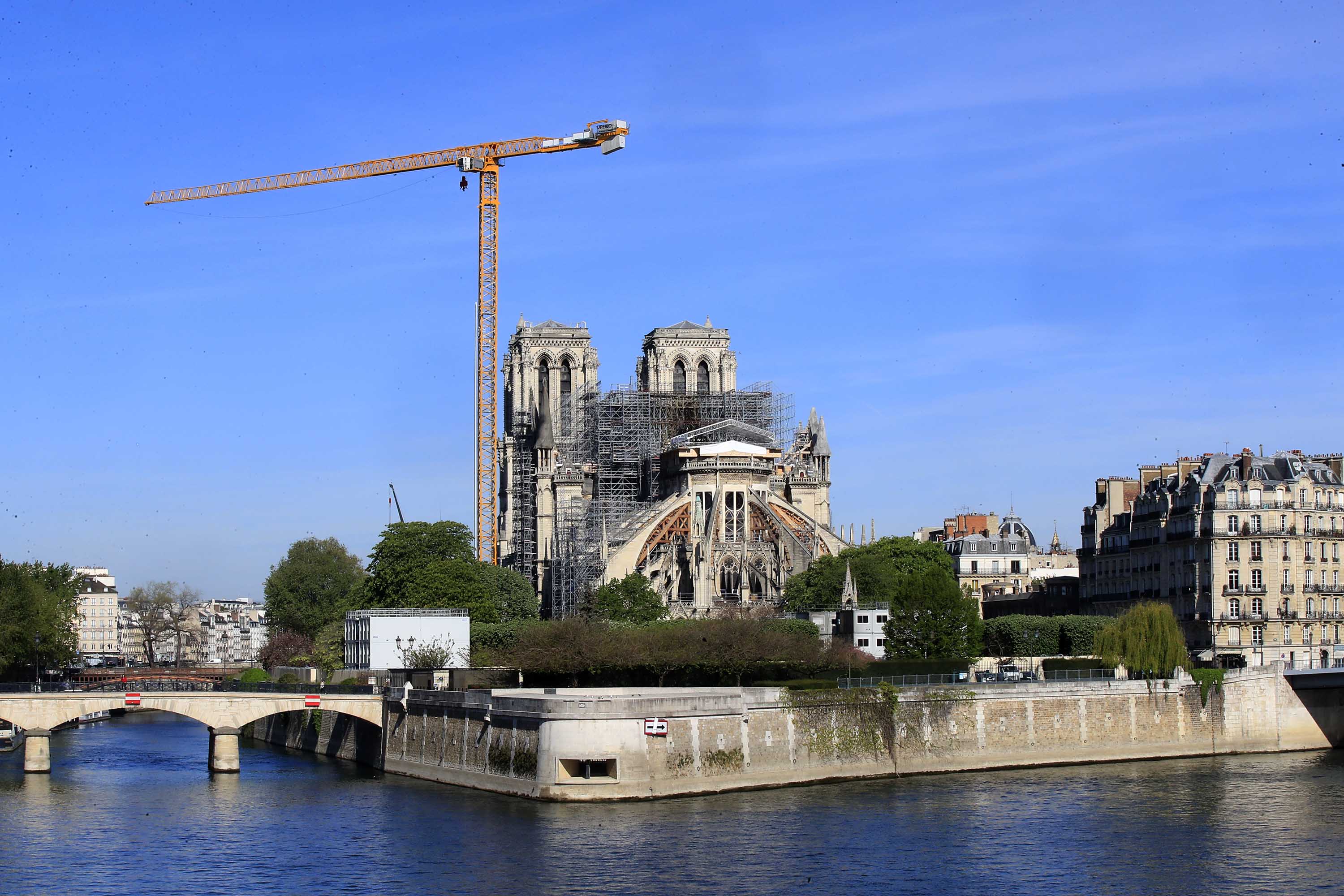 A crane stands above Notre Dame Cathedral in Paris, France, on April 15.