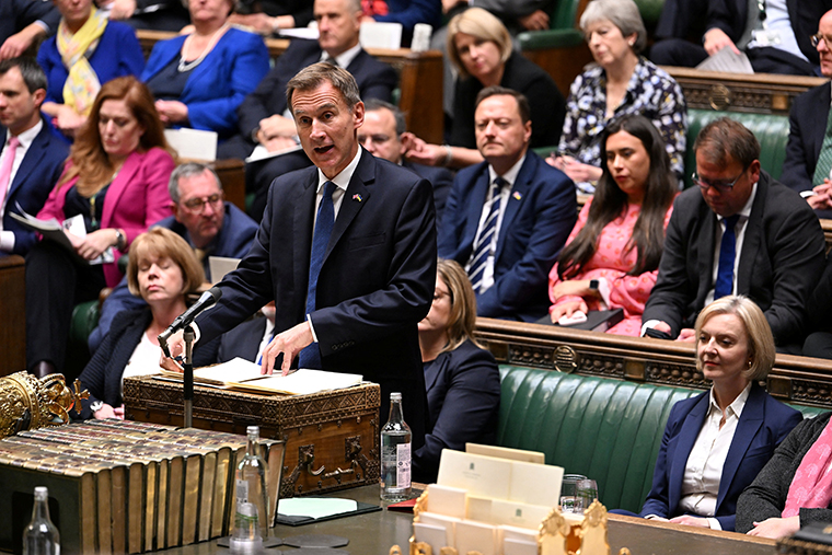 British Chancellor of the Exchequer Jeremy Hunt speaks at the House of Commons, in London on October 17.