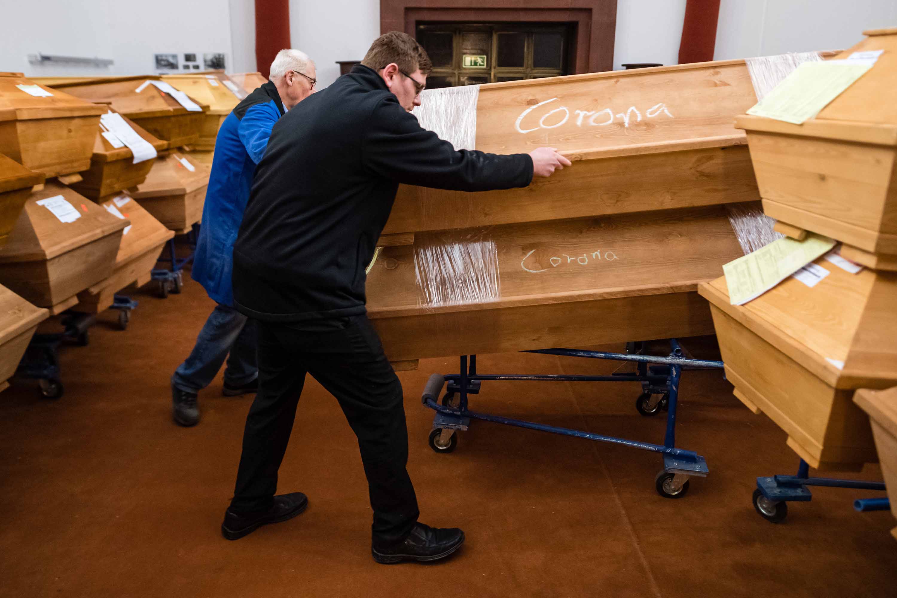 Employees move coffins at a crematorium in Meissen, Germany, Jan.13.