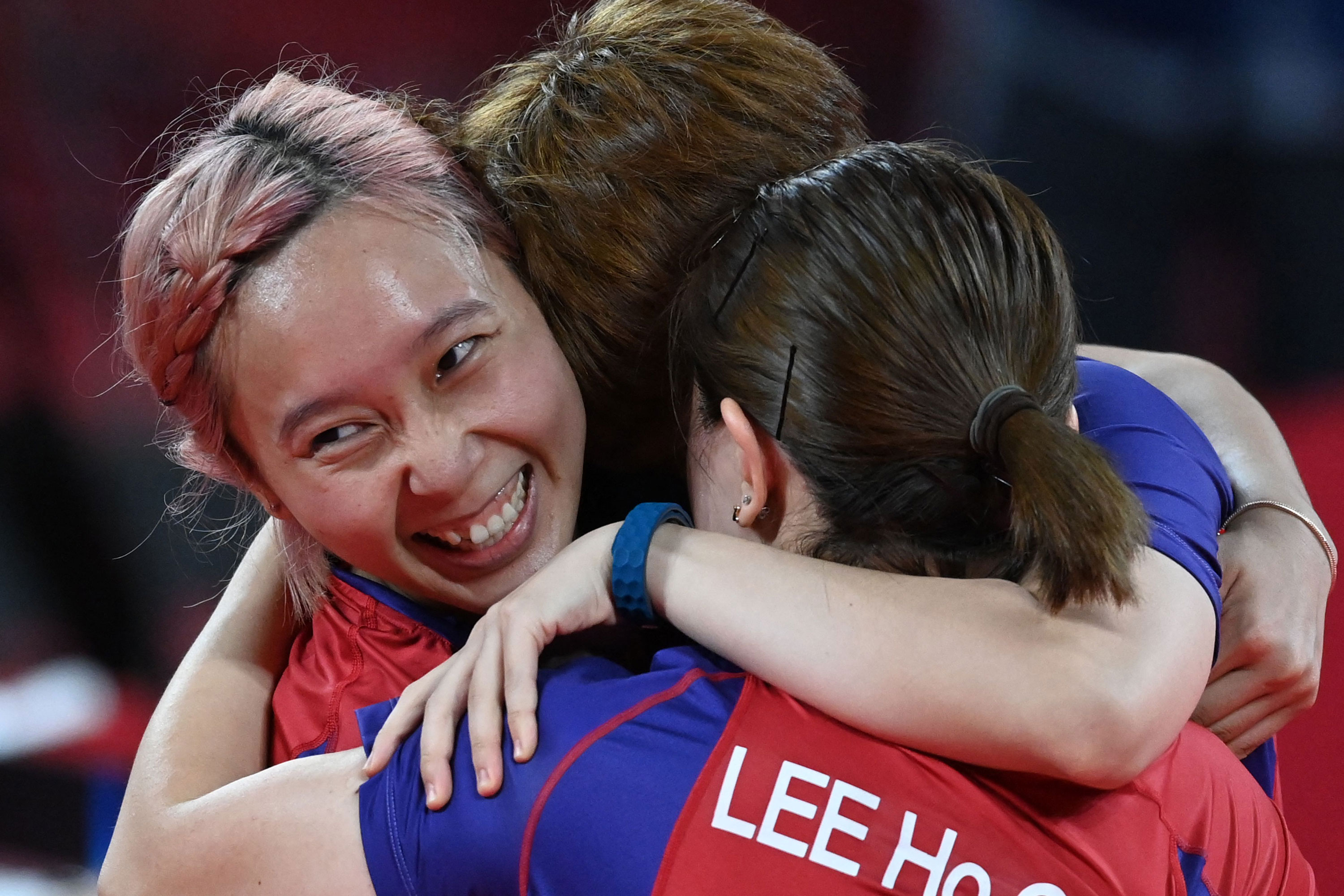 Hong Kong's Minnie Soo Wai-yam hugs her teammates after they won bronze in team table tennis on Thursday.