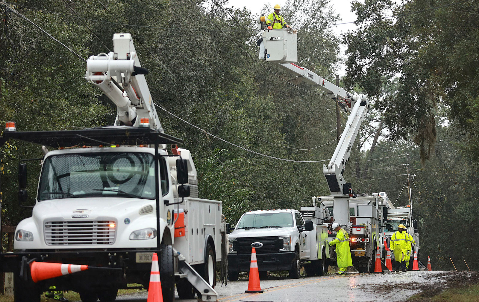 Linemen work on electric lines in Fruitland Park, Florida, on Thursday, November 10.