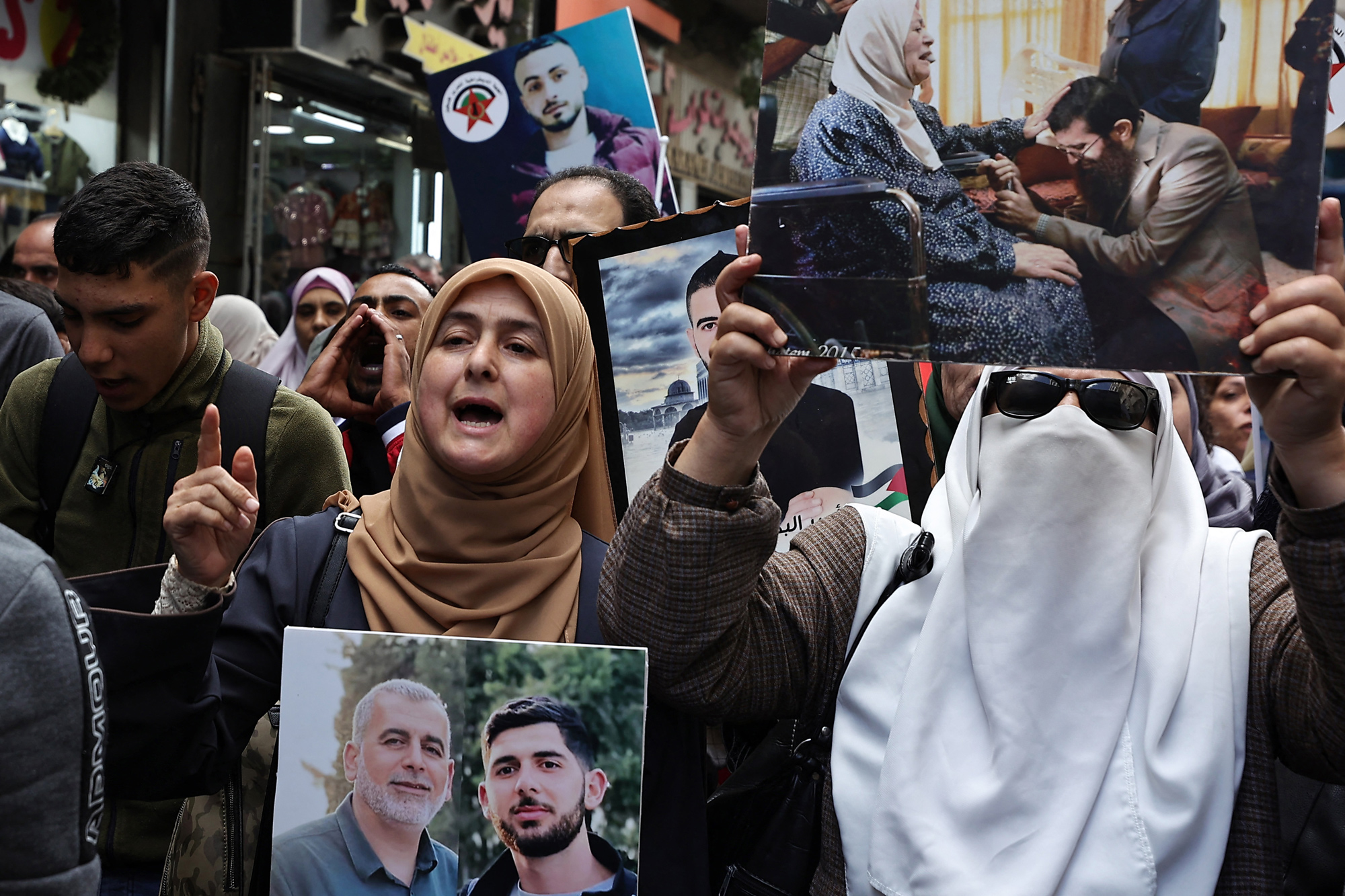 Protesters chant during a rally in Ramallah city in the occupied West Bank, in support of Gaza and of Palestinian prisoners in Israeli jails, on November 14.