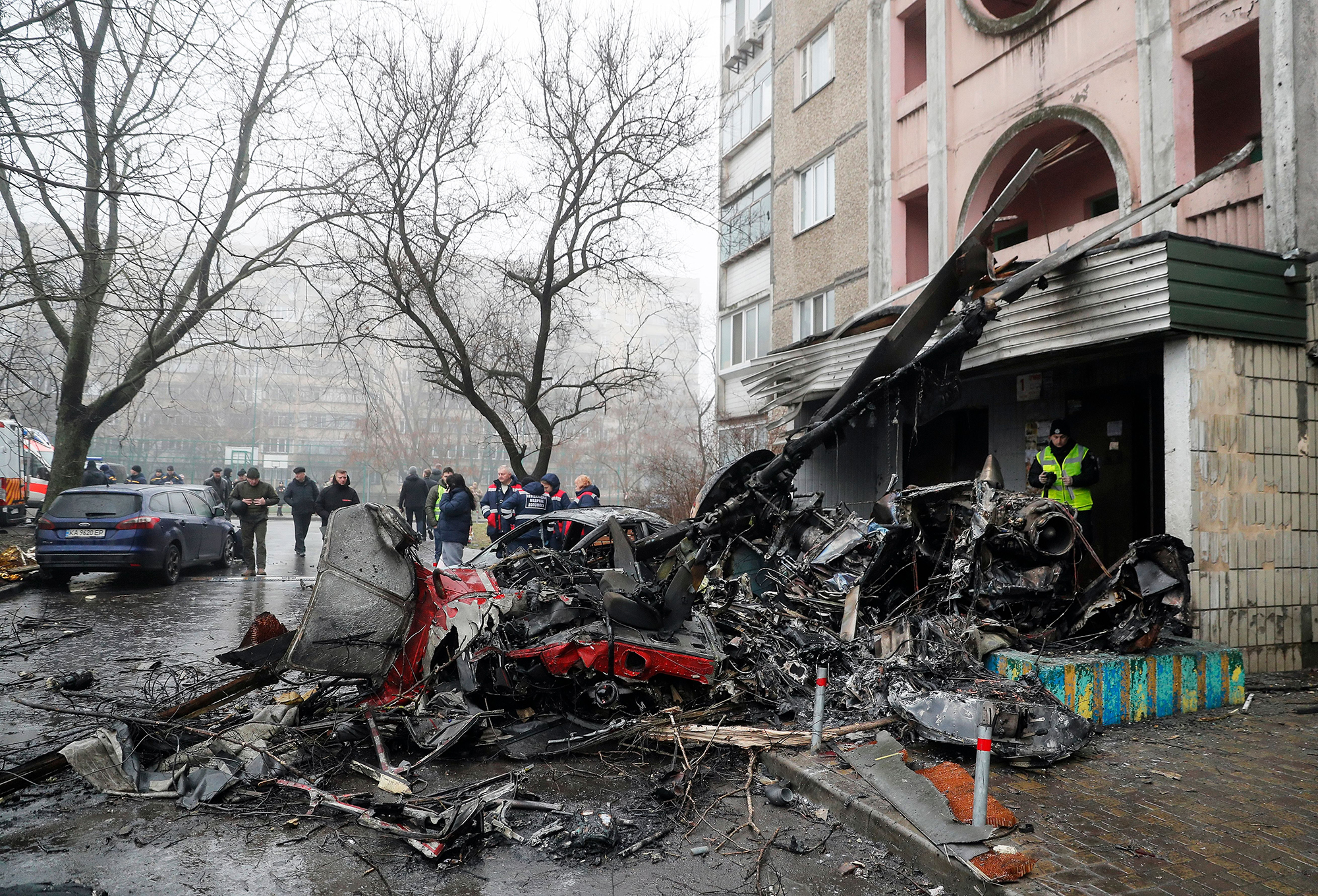 Rescue services work at the scene of a helicopter crash in Brovary, Ukraine, on January 18.