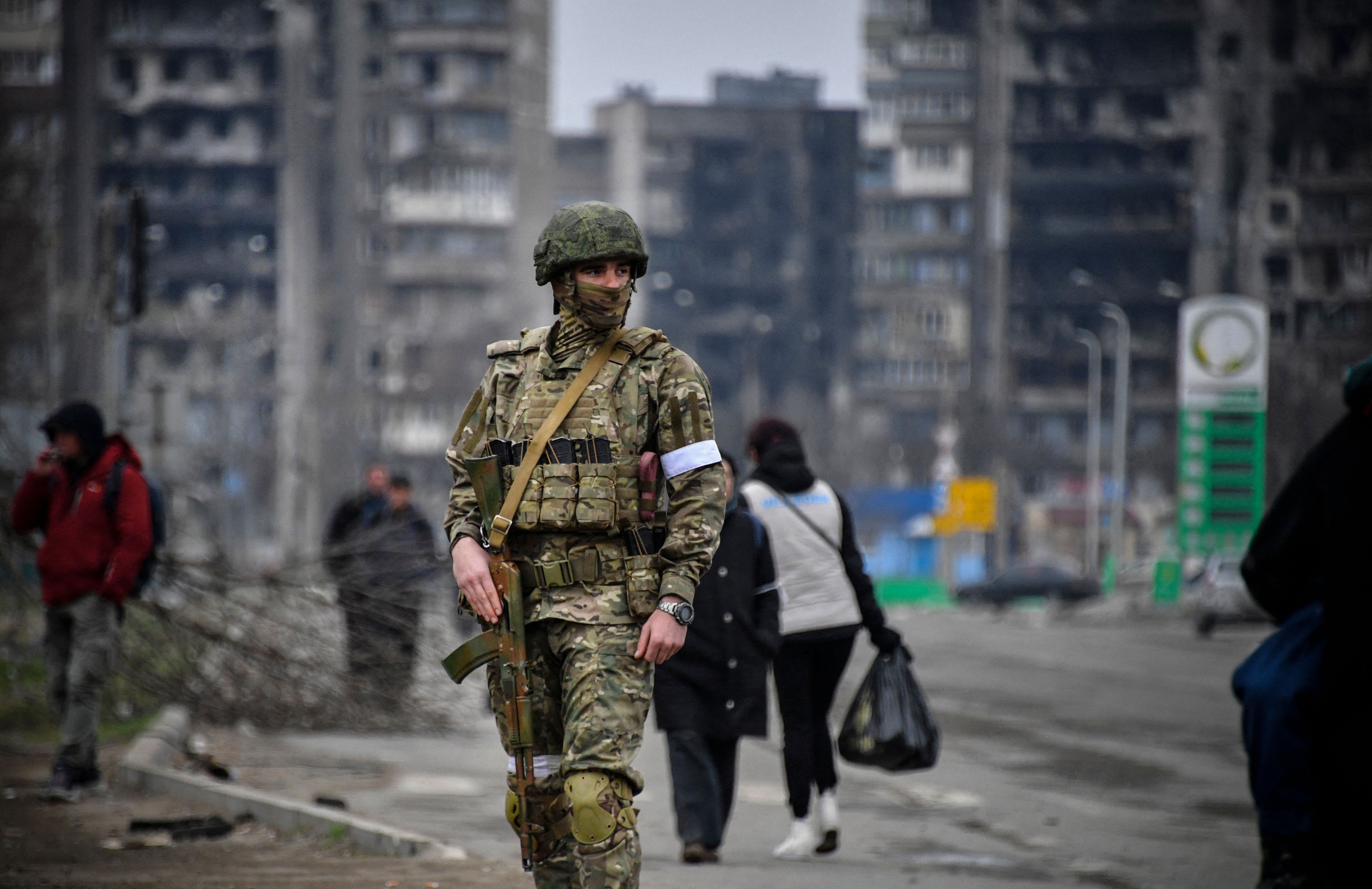 Editor's note: This photo was taken during a trip organized by the Russian military. It shows a Russian soldier on patrol in Mariupol on April 12.