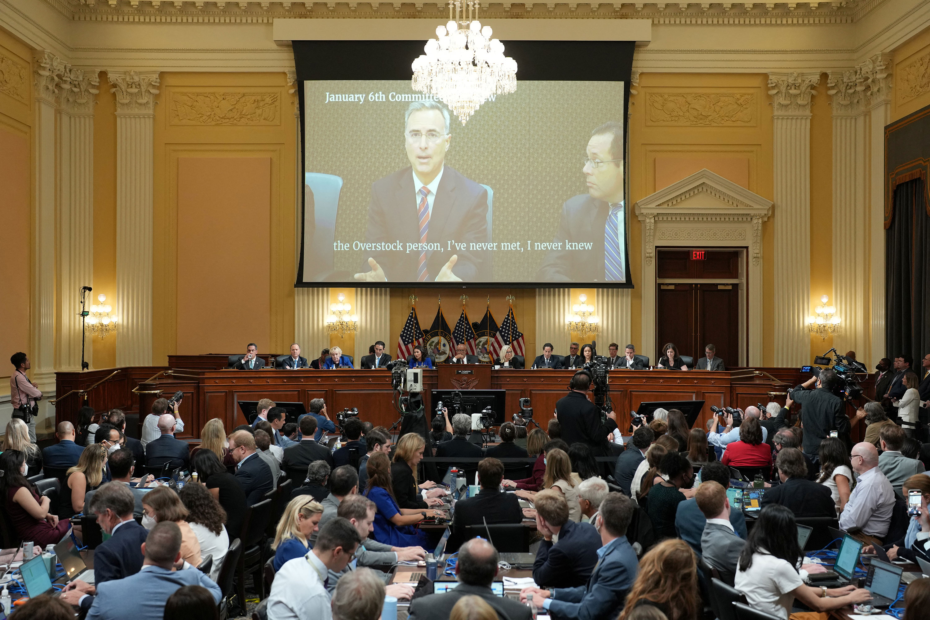 A video of Pat Cipollone's testimony is shown on a screen during a public hearing in Washington, DC, on Tuesday. 