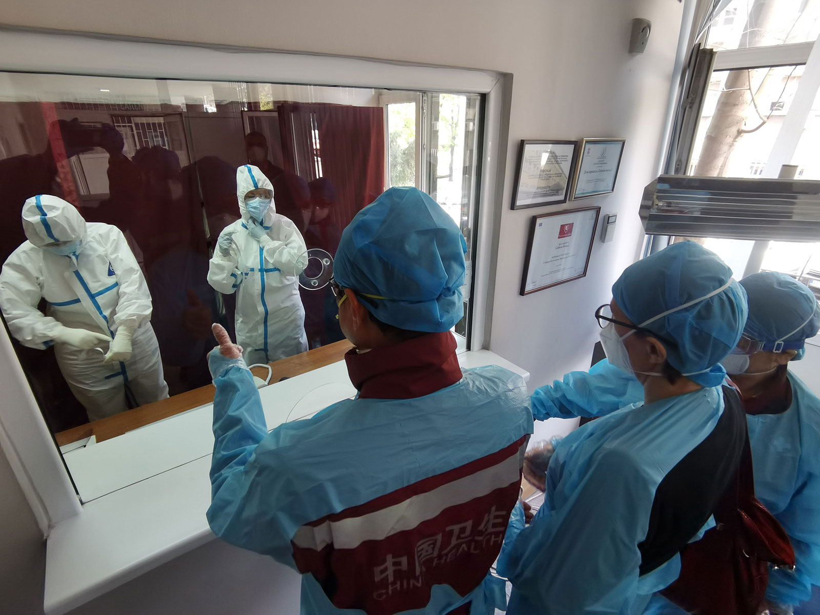 Members of a Chinese medical team visit a clinic in Belgrade, Serbia, on April 11.