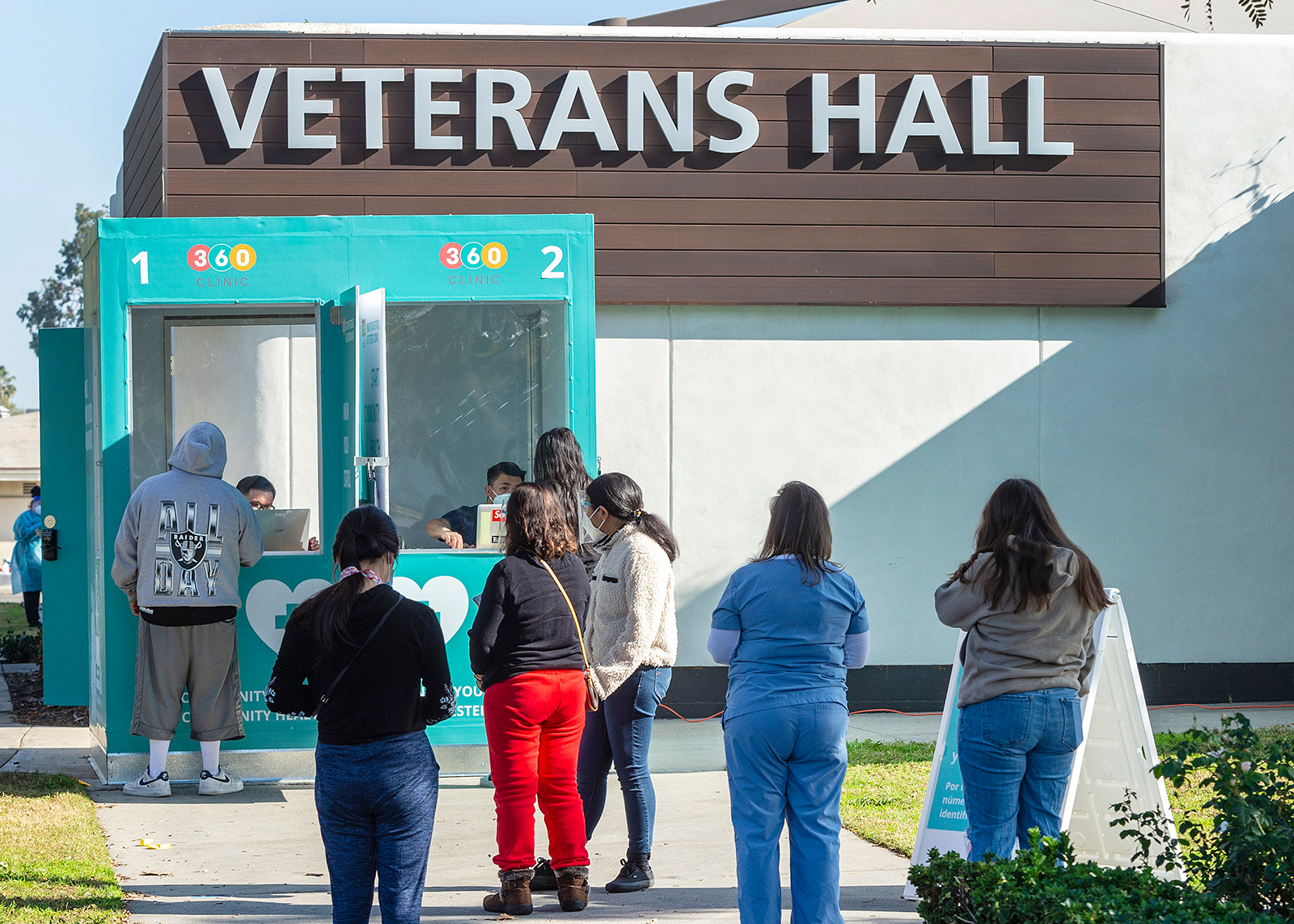 People line up at the 360 COVID-19 Mobile Testing Kiosk to get their self-administer tests, in Buena Park, California, on January 8.