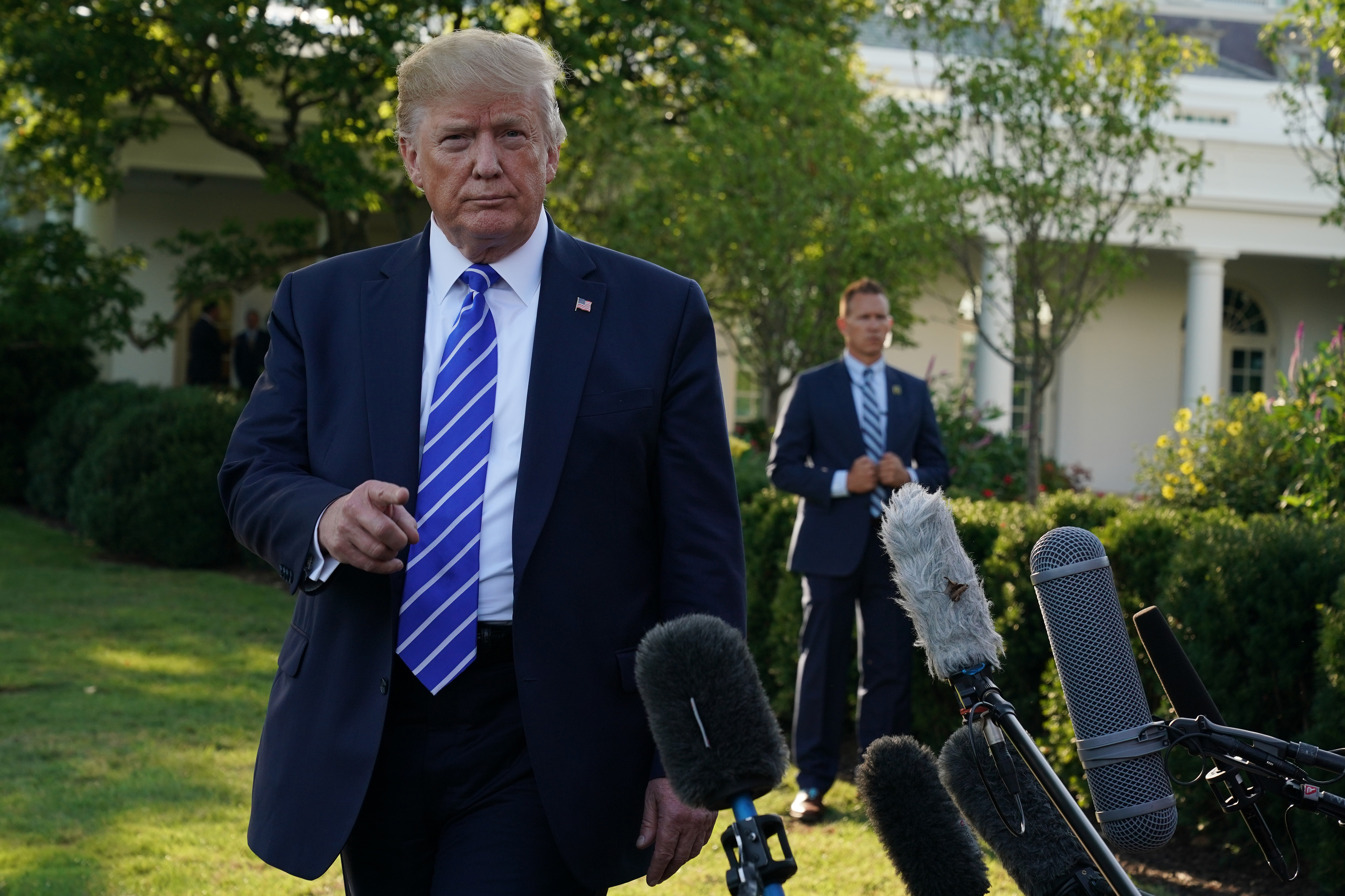 President Donald Trump addressed members of the media on Friday before he left for Camp David.