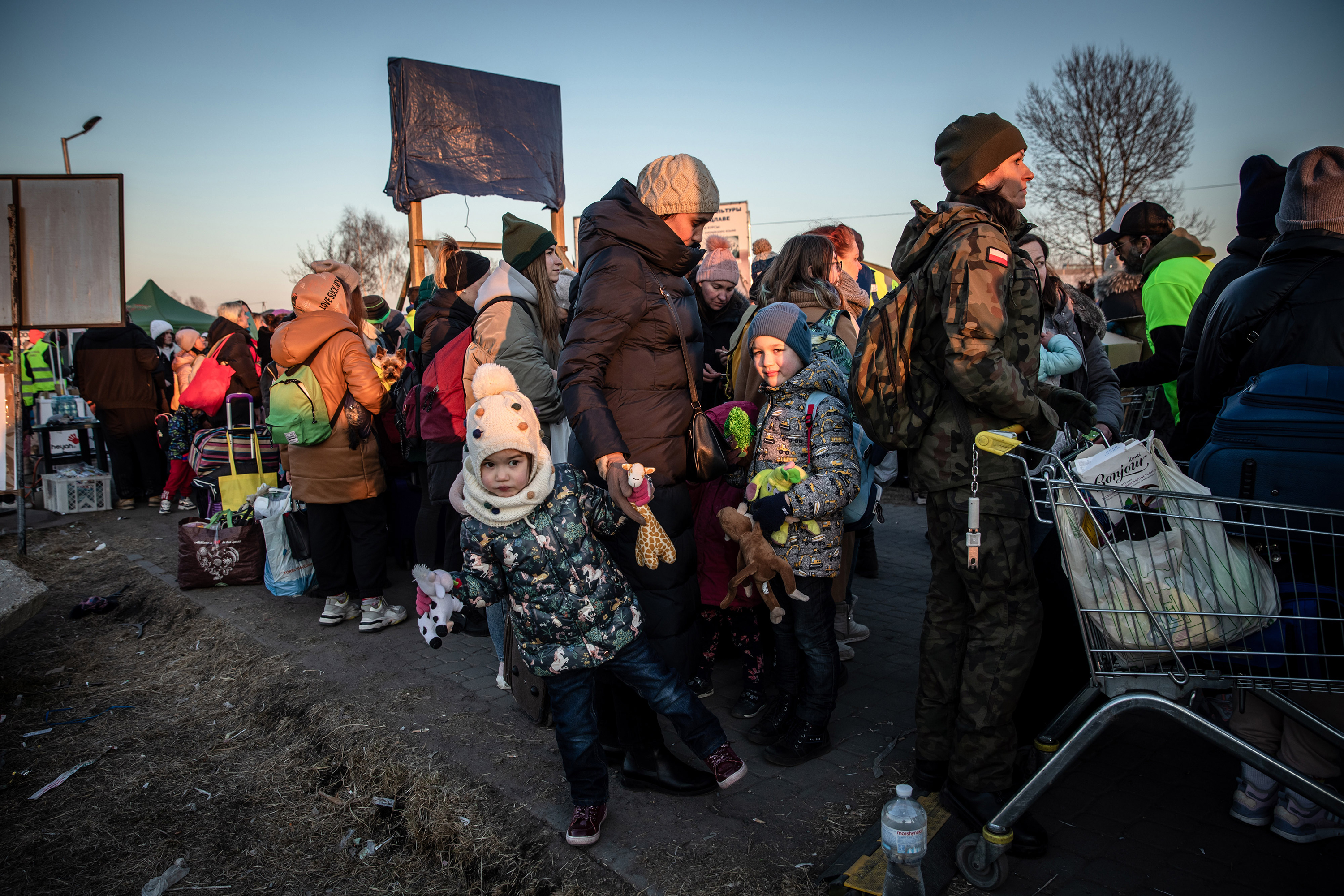 Ukrainian refugees wait to cross the border in Medyka, Poland on March 18. 