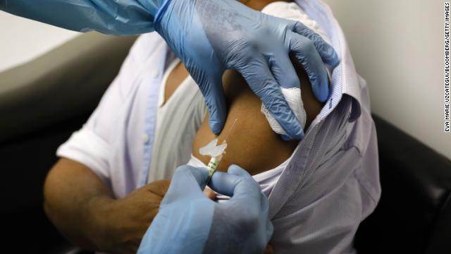 A health worker injects a person during clinical trials for a Covid-19 vaccine at Research Centers of America in Hollywood, Florida, on Sept. 9, 2020.