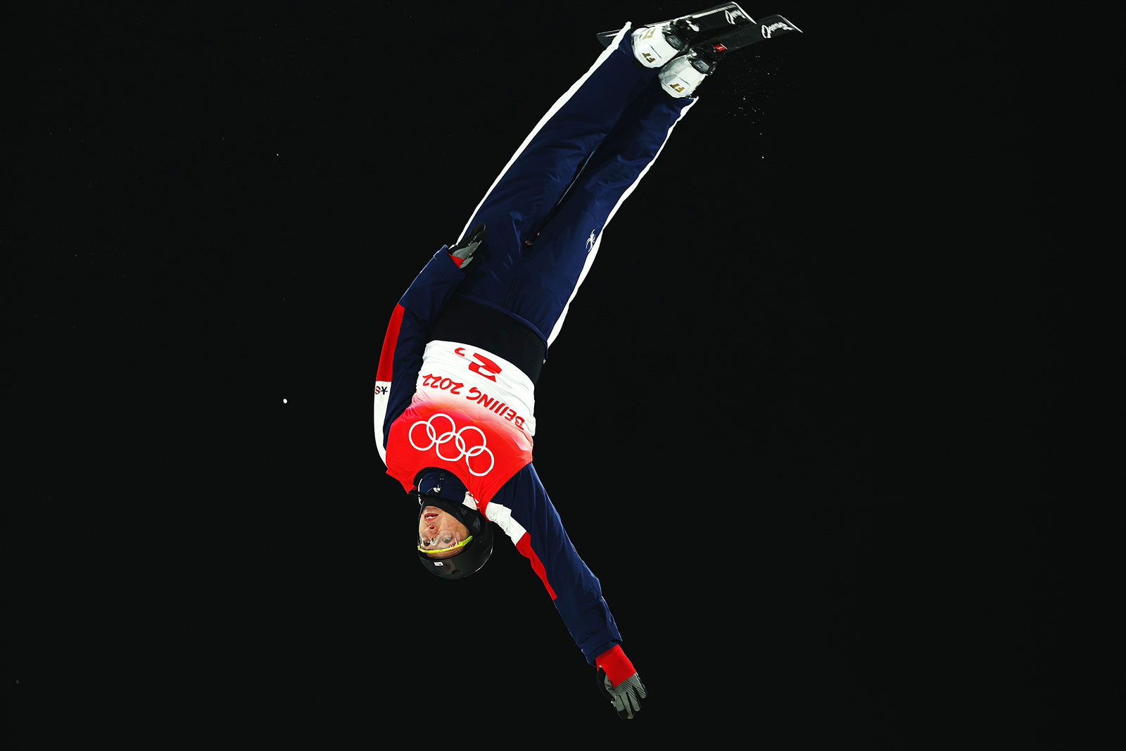 American freestyle skier Christopher Lillis performs a trick during the mixed team aerials on February 10.