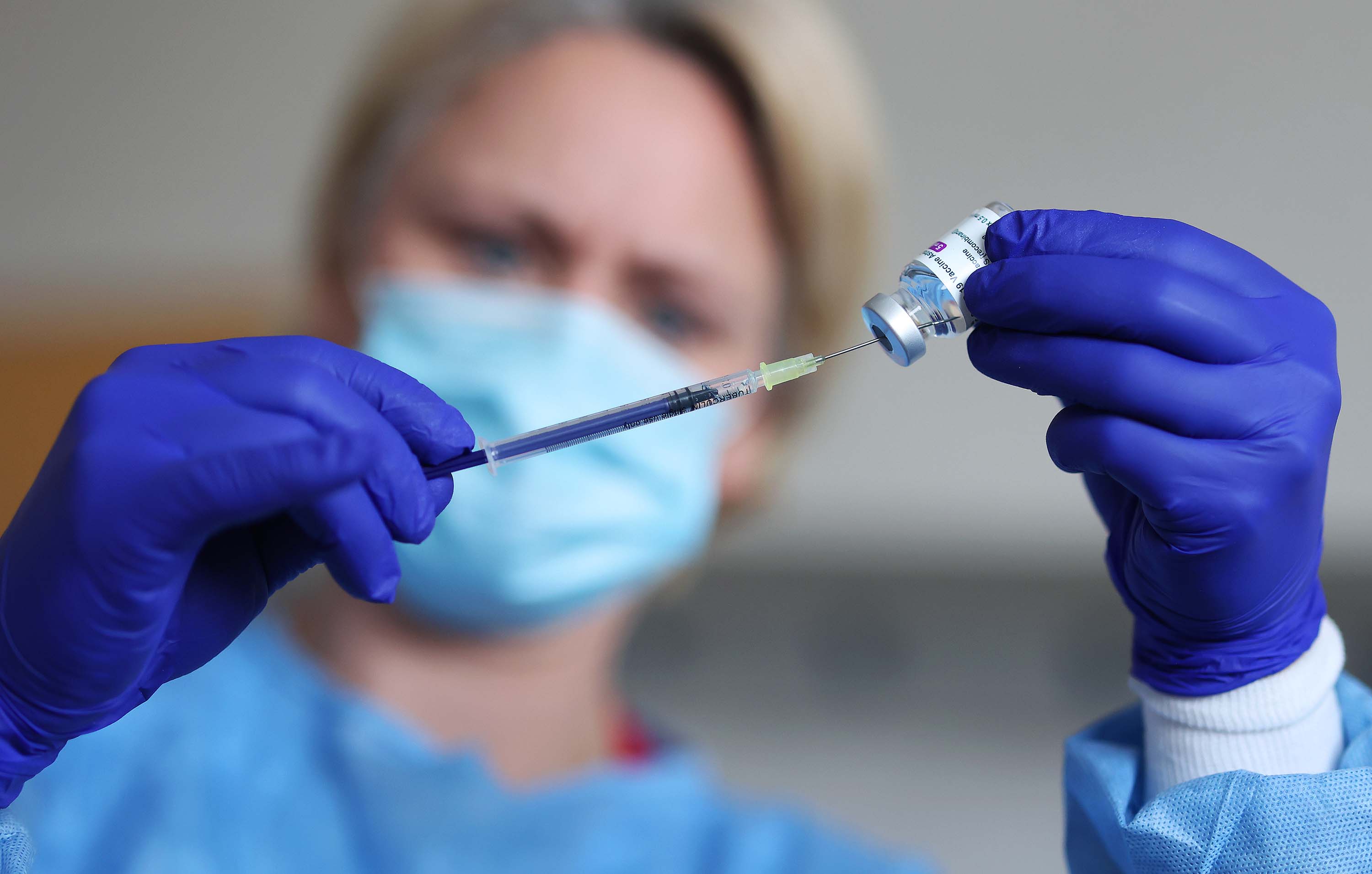 A doctor prepares a syringe with the AstraZeneca vaccine at the Saxony-Anhalt police medical service vaccination center in Magdeburg, Germany, on March 10. 